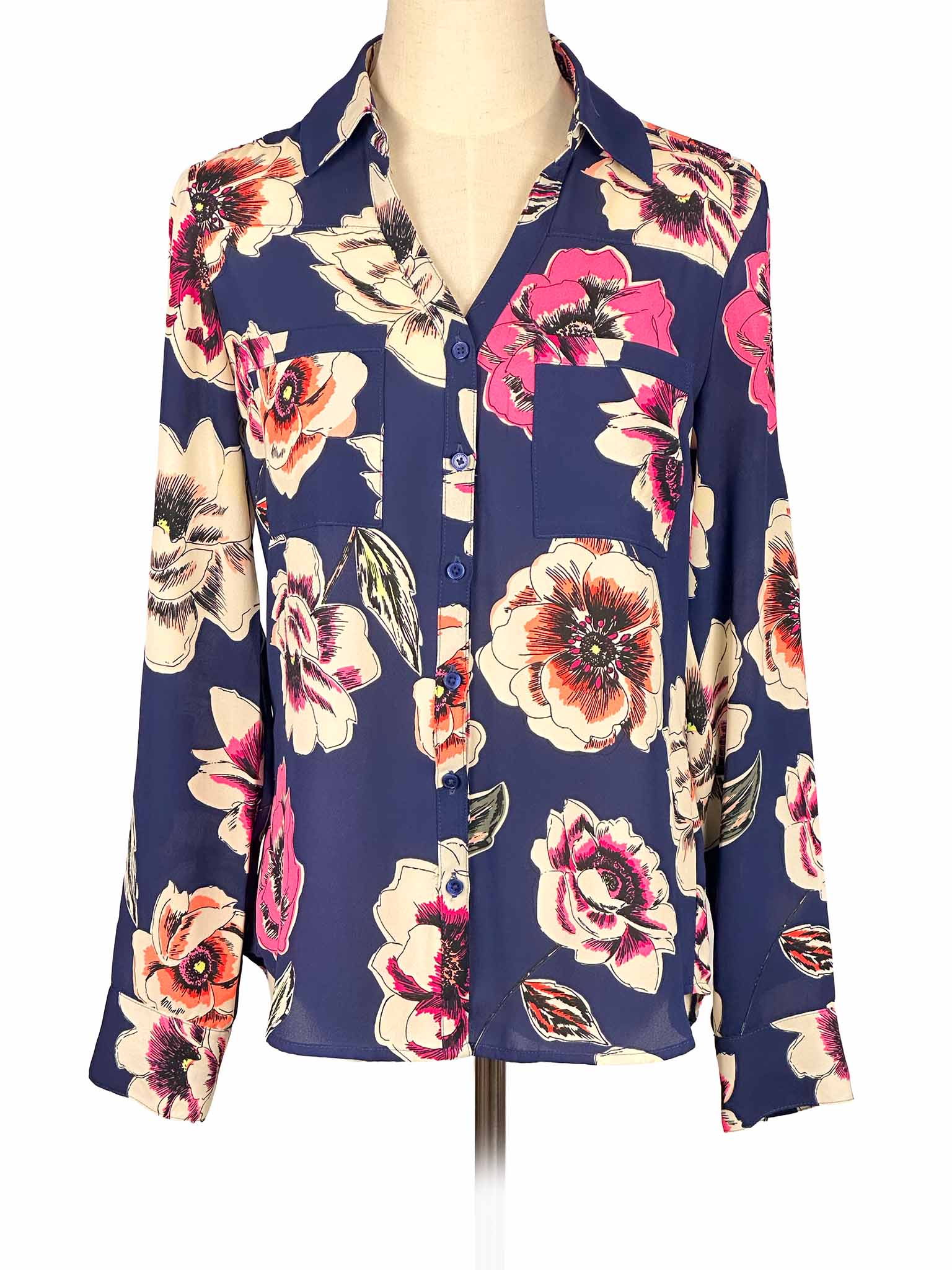 Floral Express blouse on a mannequin against a white background