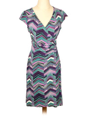 Multicolored zigzag-patterned Ann Taylor dress on a mannequin against a white background
