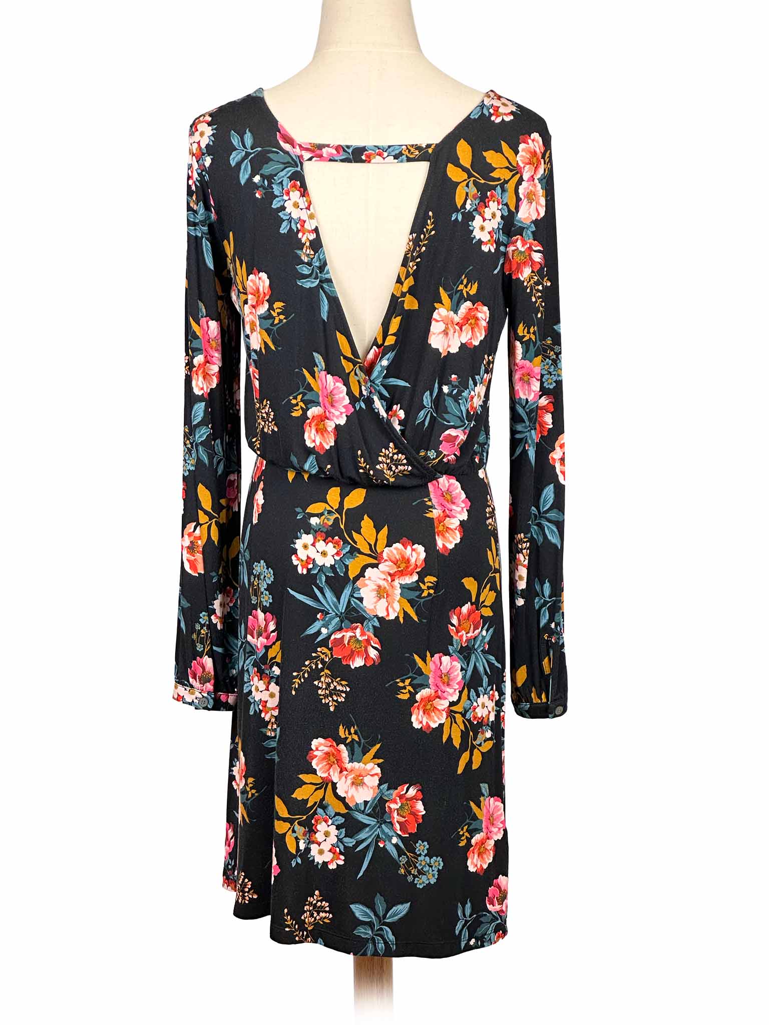 Loft floral dress on a mannequin against a white background