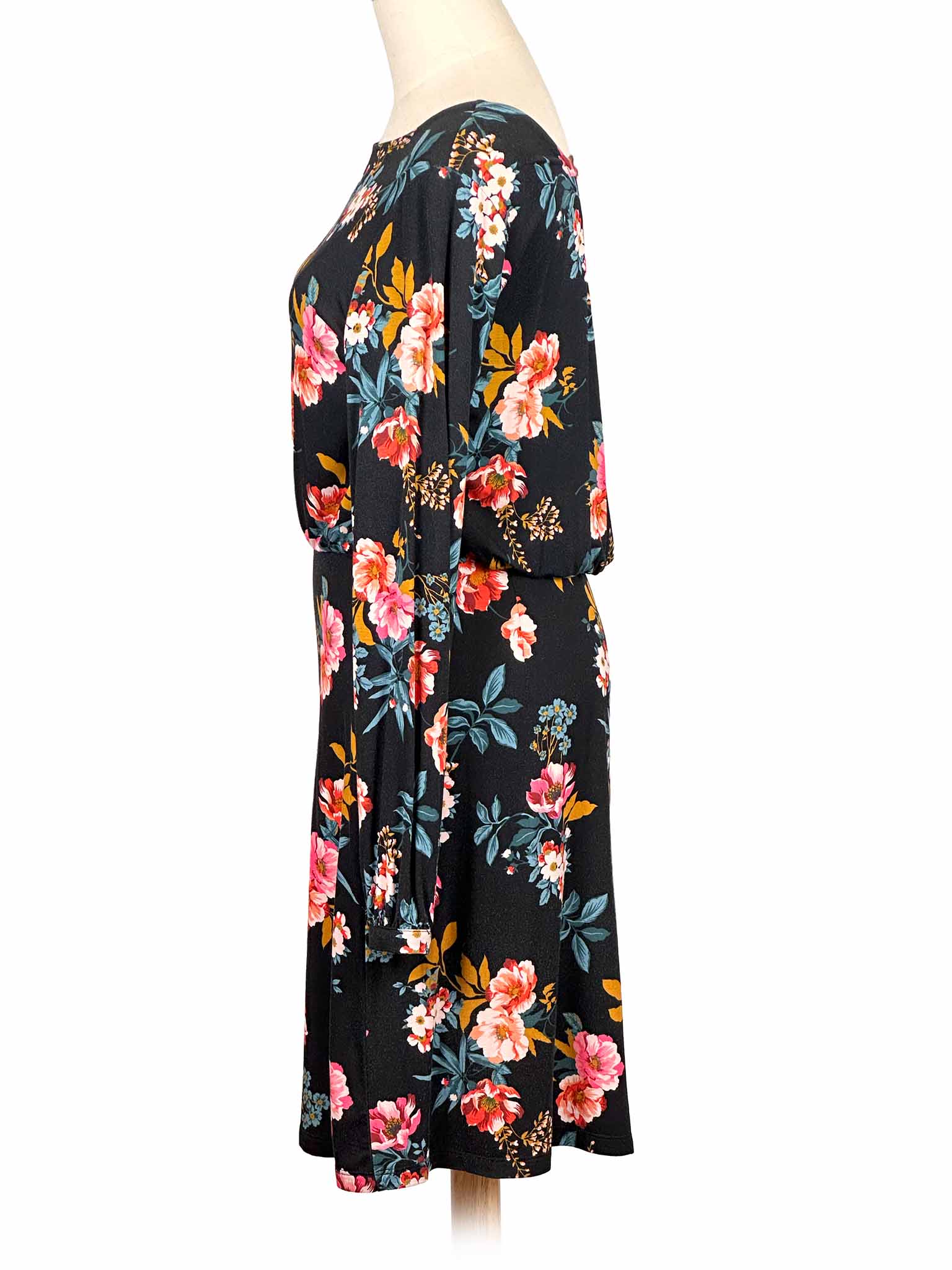 Loft floral dress on a mannequin against a white background