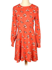 Red floral Loft dress on a mannequin against a white background