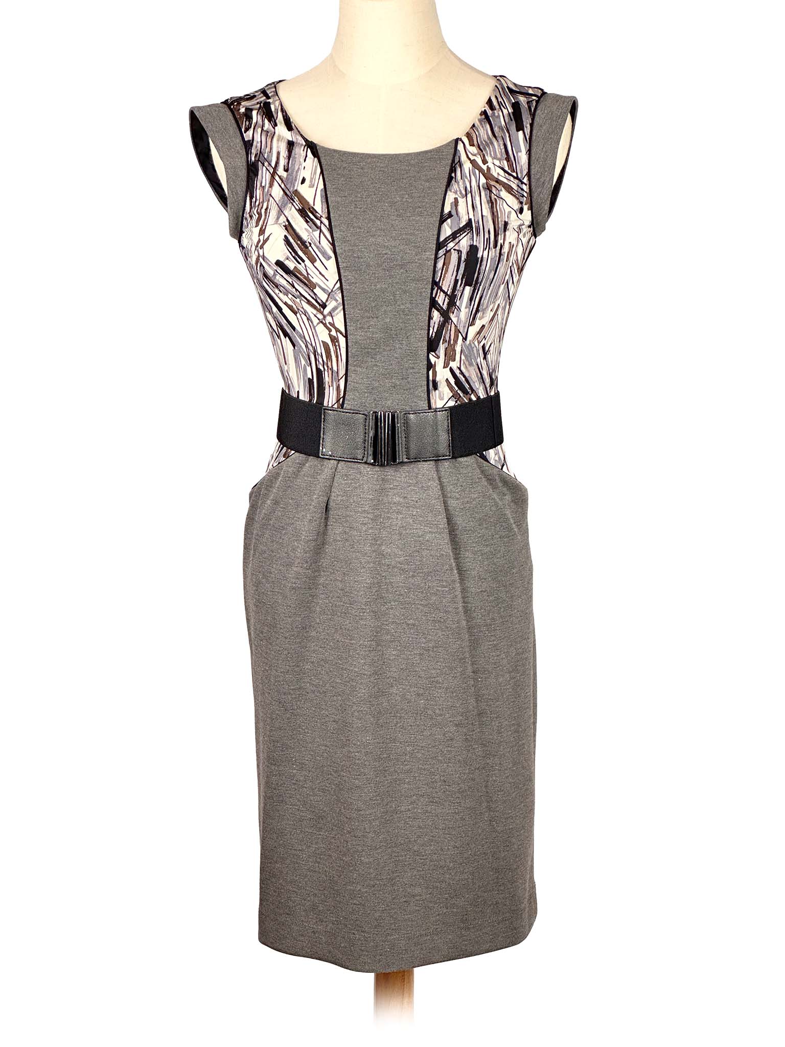 Gray BCBG MaxAzria dress with patterned details on a mannequin against a white background