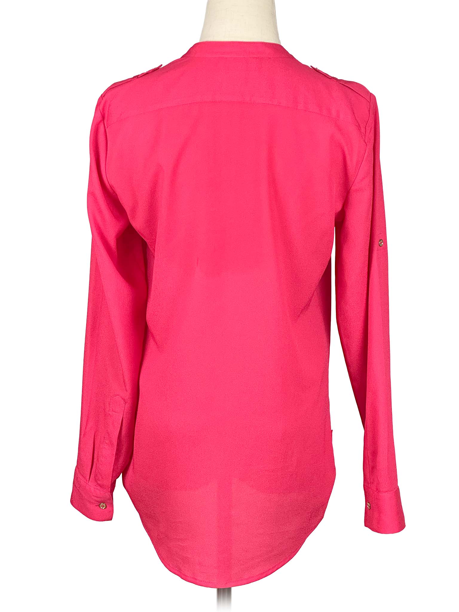 Pink Calvin Klein shirt on a mannequin with a white background