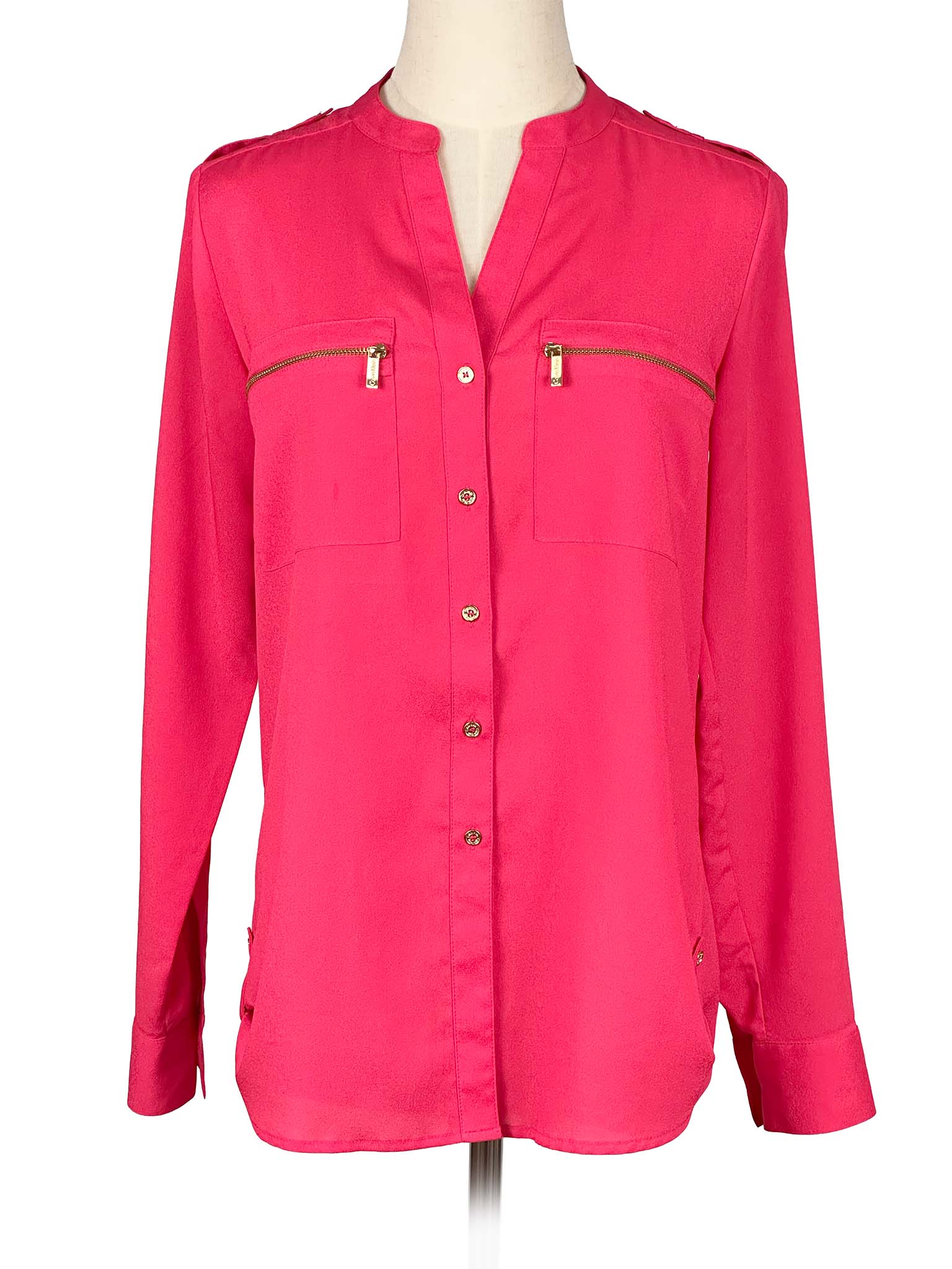 Pink Calvin Klein shirt on a mannequin with a white background