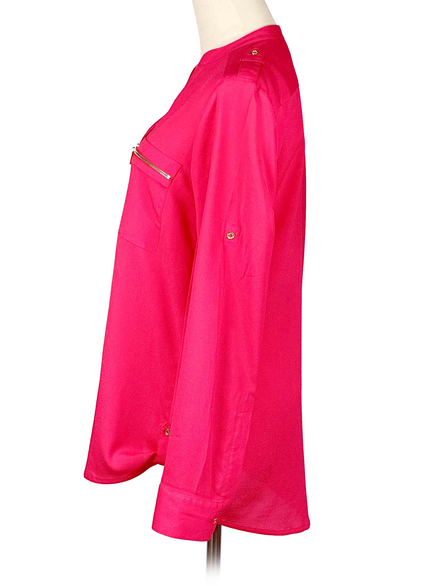 Pink Calvin Klein shirt on a mannequin with a white background