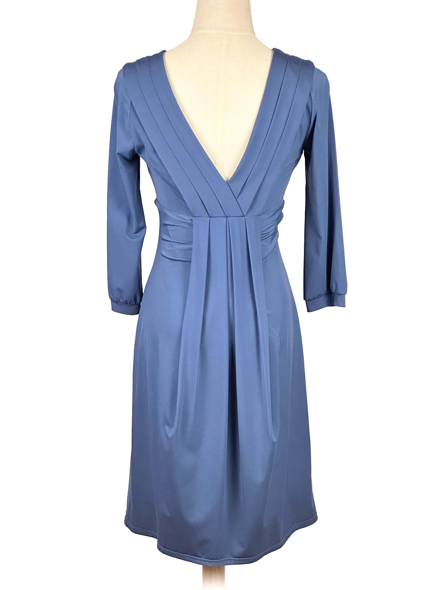 Blue BCBGMaxAzria dress on a mannequin against a white background