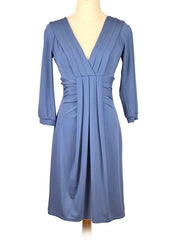 Blue BCBGMaxAzria dress on a mannequin against a white background