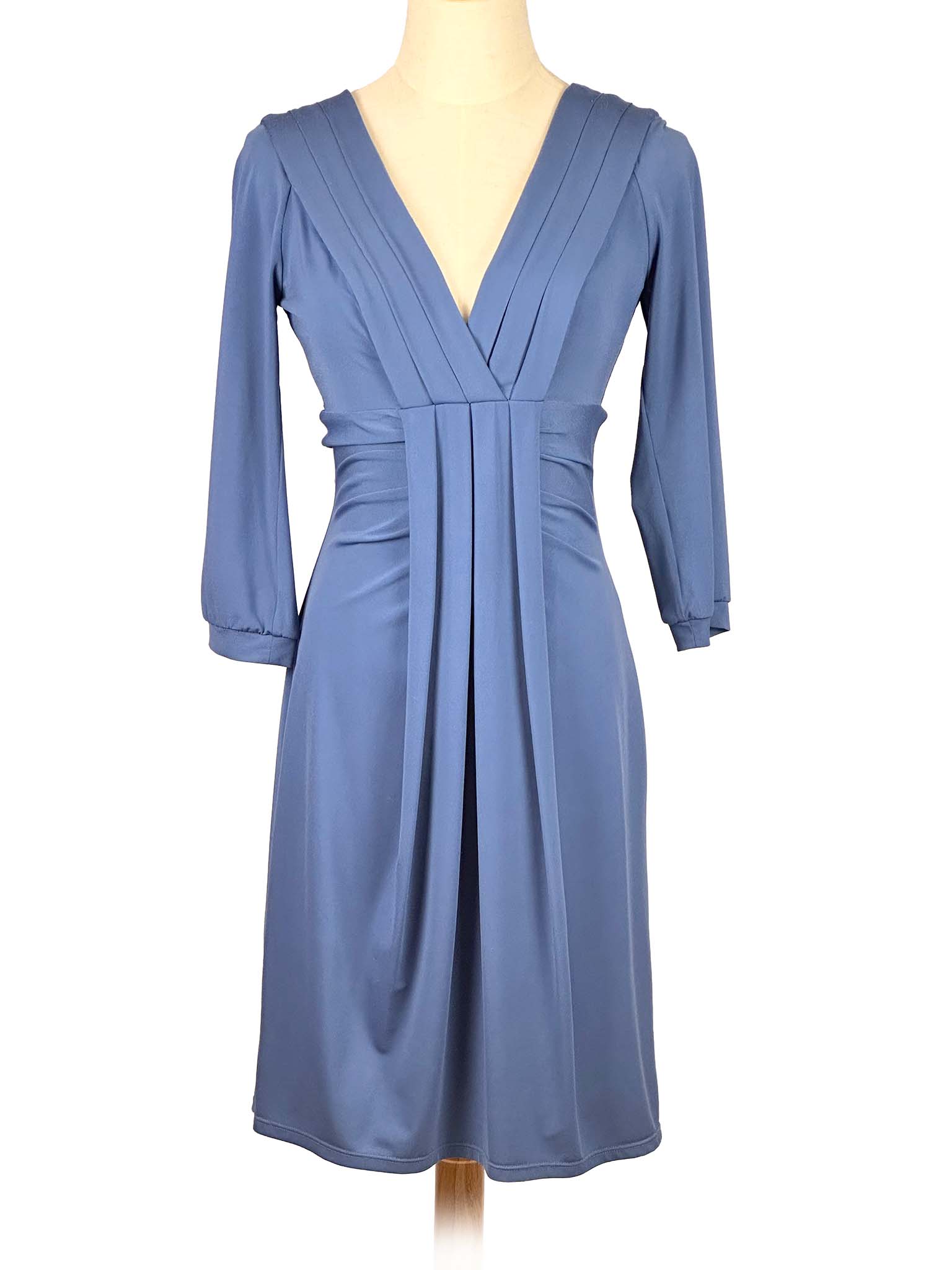 Blue BCBGMaxAzria dress on a mannequin against a white background