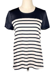 Black and white striped Michael Kors t-shirt on a mannequin against a white background