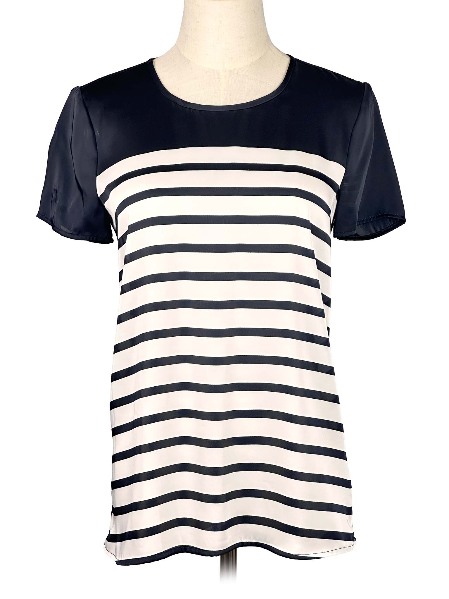 Black and white striped Michael Kors t-shirt on a mannequin against a white background