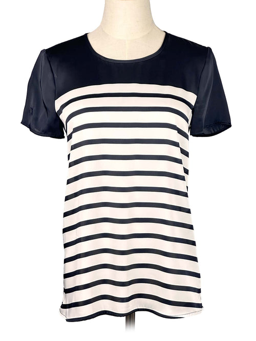 Black and white striped Michael Kors t-shirt on a mannequin against a white background