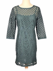 Green lace Loft dress on a mannequin against a white background