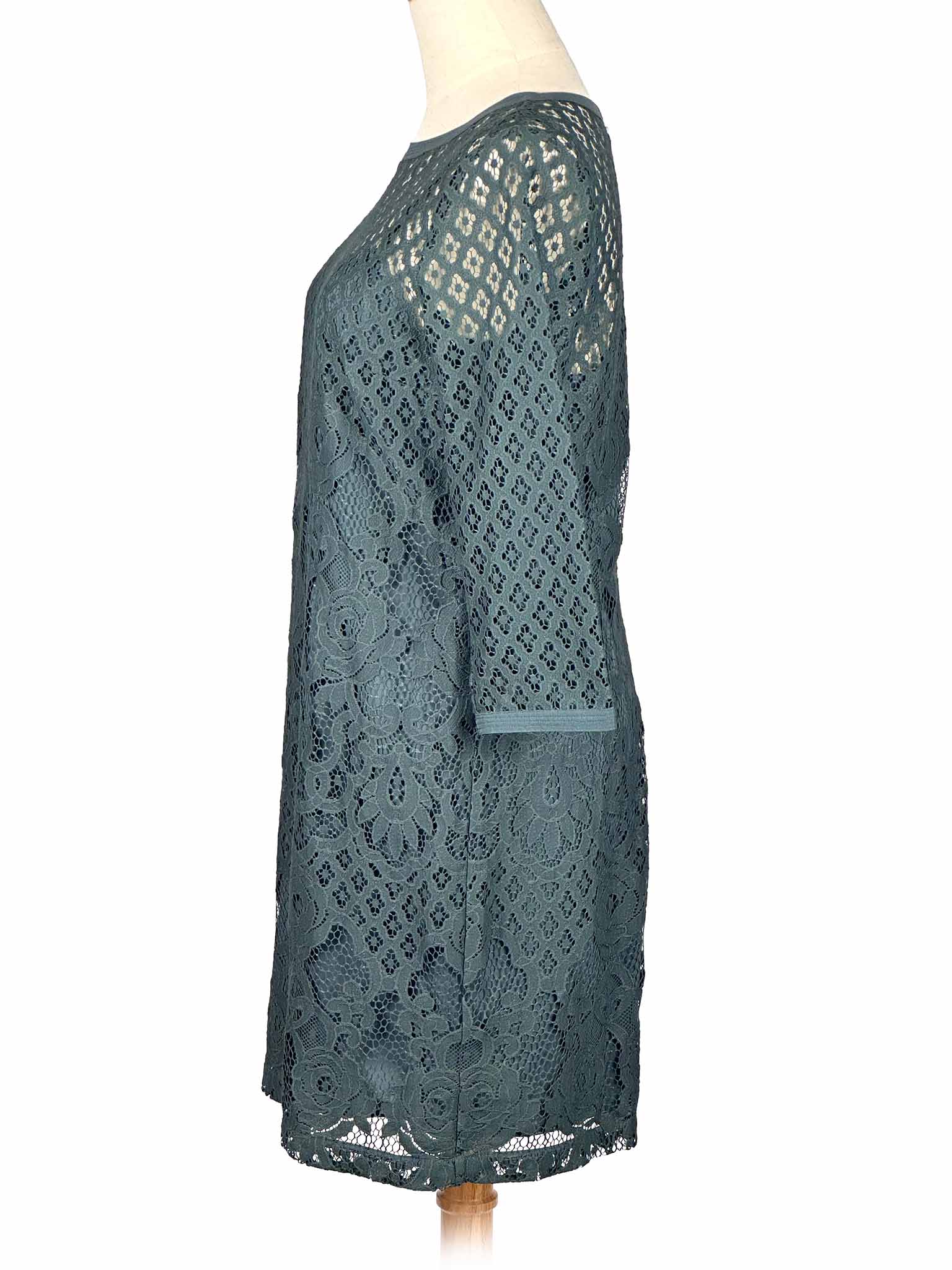 Green lace Loft dress on a mannequin against a white background