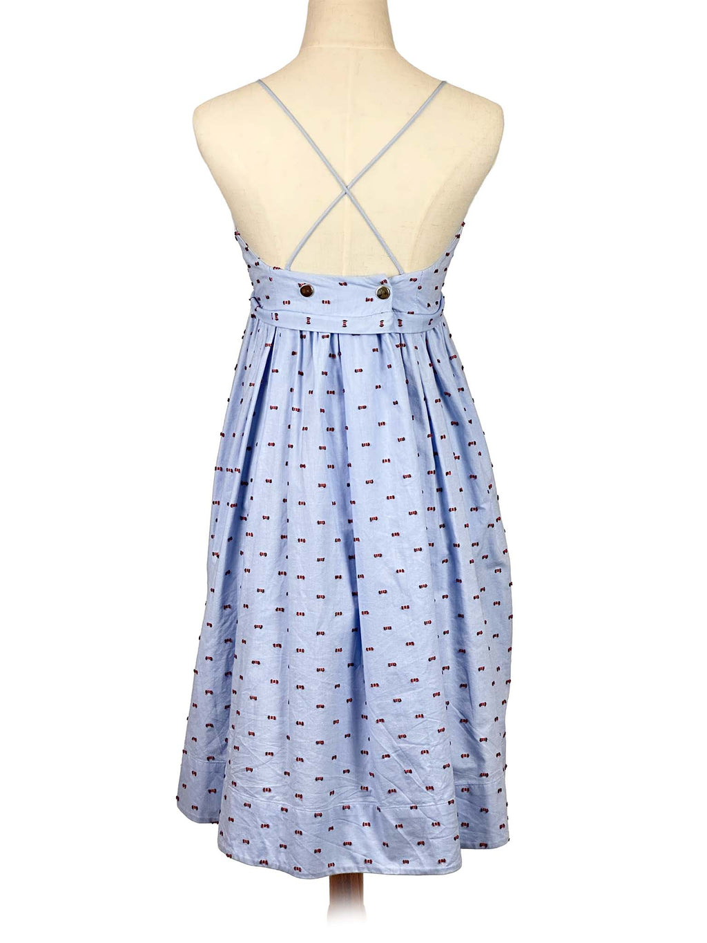 Victoria Bekham light blue dress with subtle pattern on a mannequin against a white background