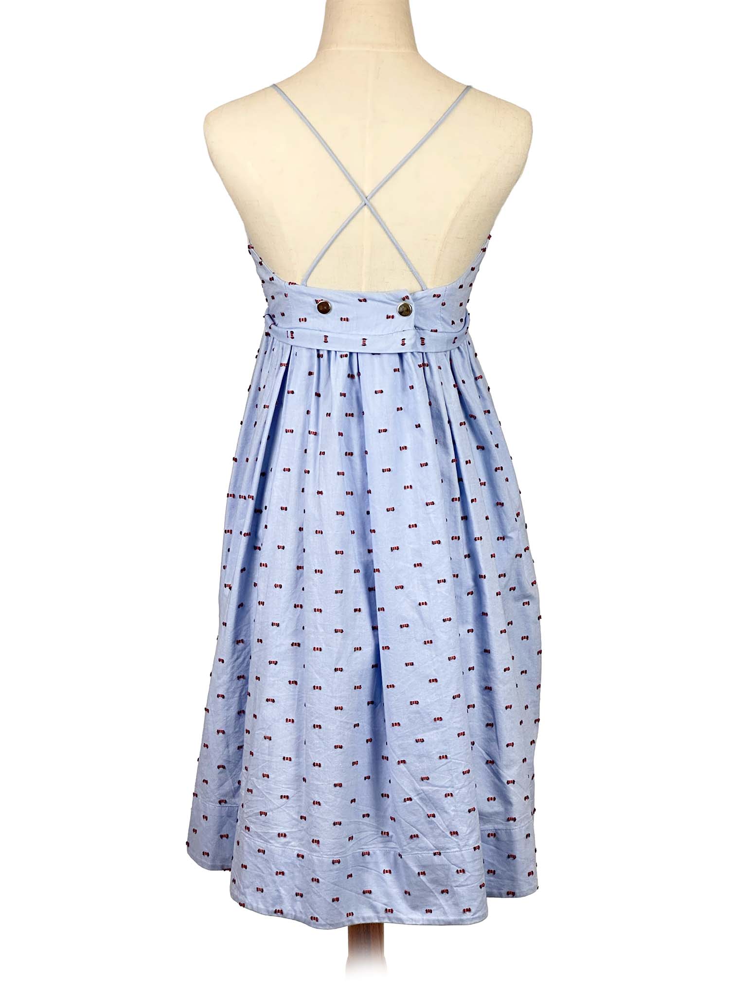 Victoria Bekham light blue dress with subtle pattern on a mannequin against a white background