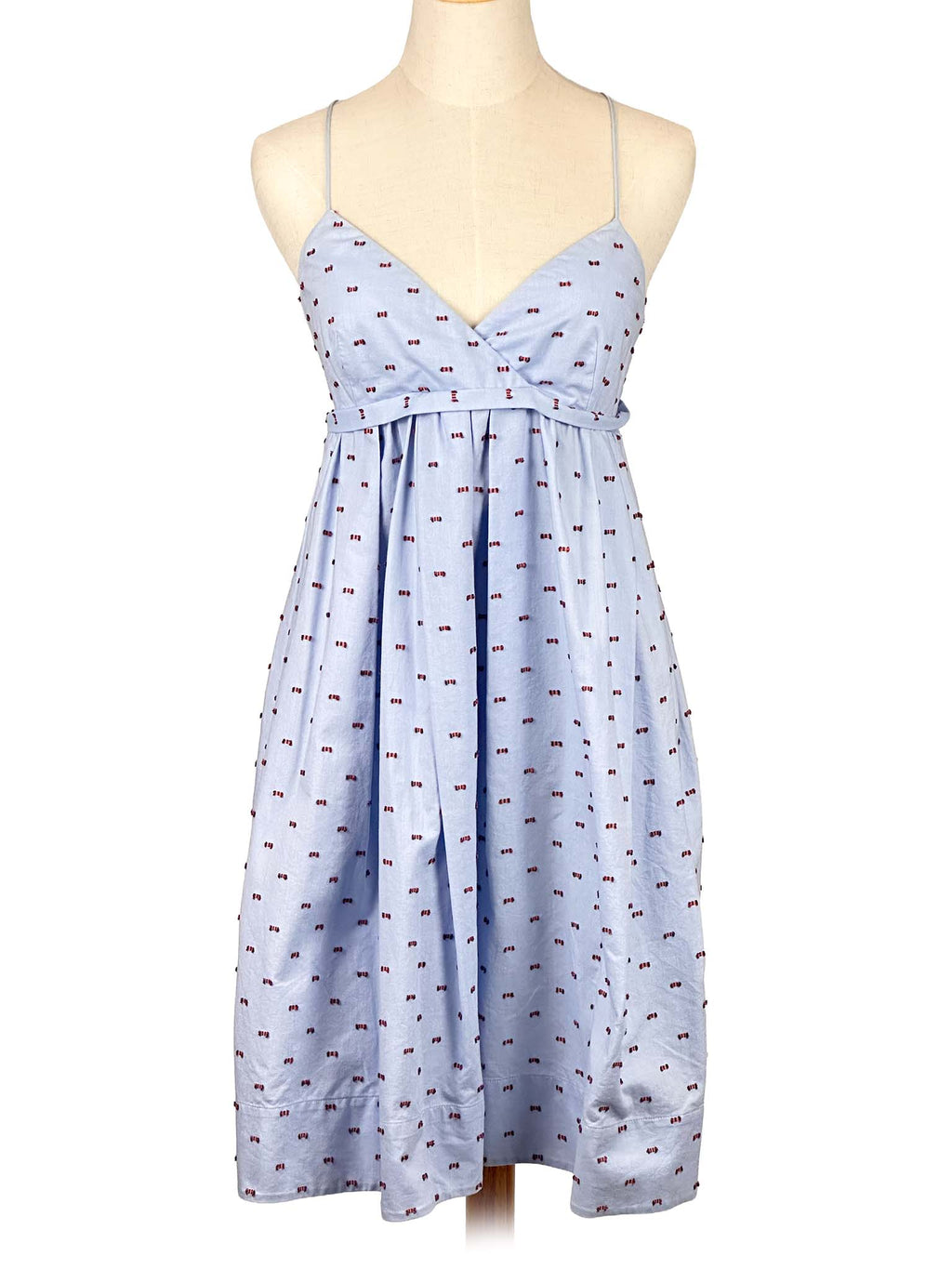 Victoria Bekham light blue dress with subtle pattern on a mannequin against a white background