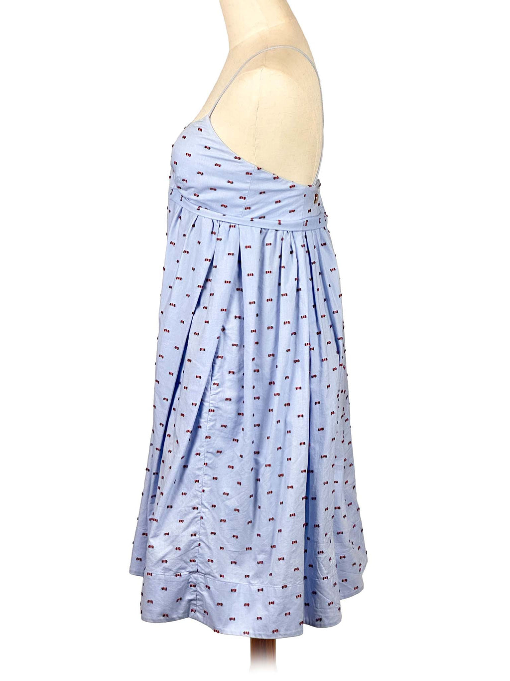 Victoria Bekham light blue dress with subtle pattern on a mannequin against a white background
