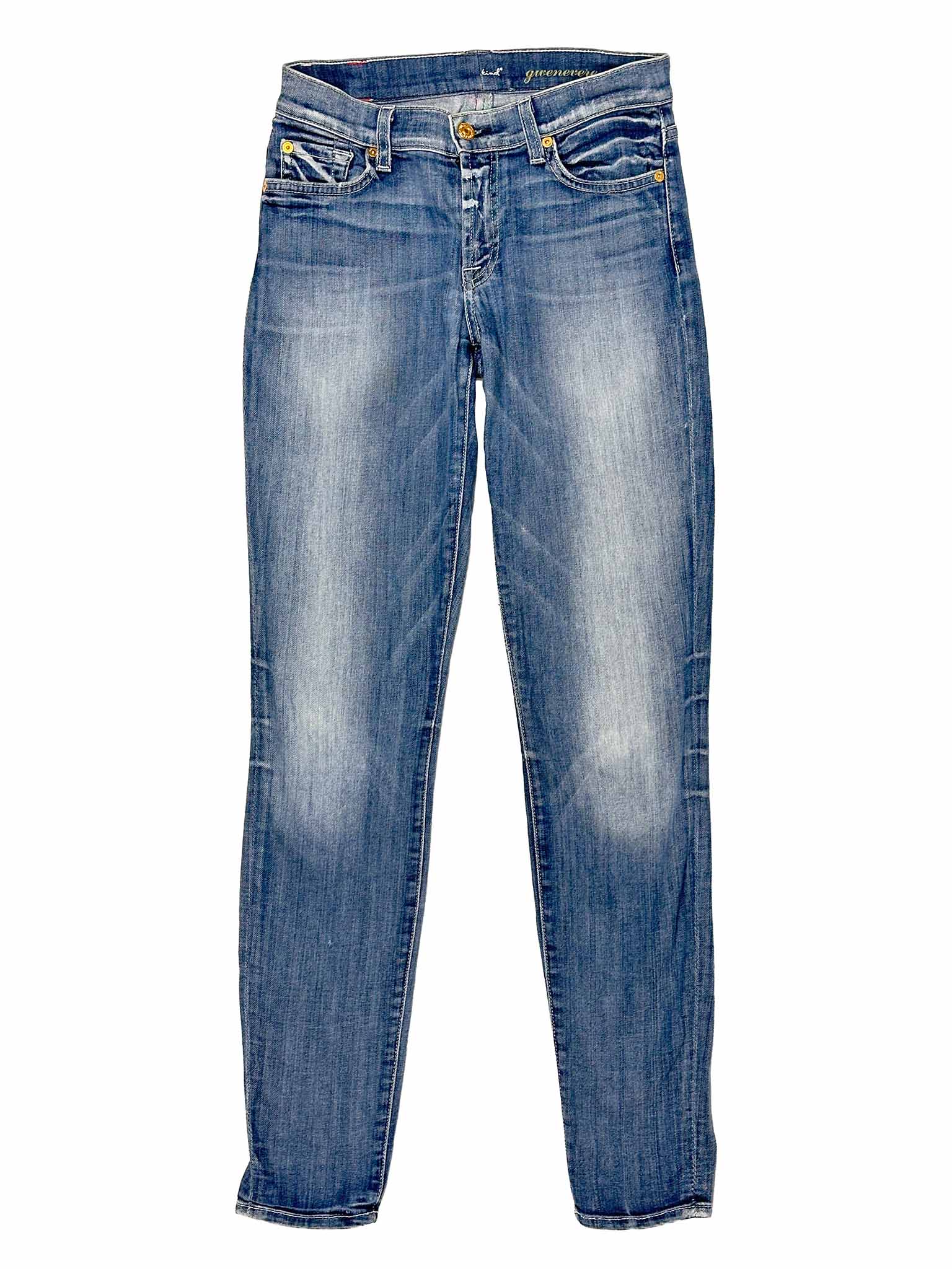 Pair of blue 7 For All Mankind jeans on a white background