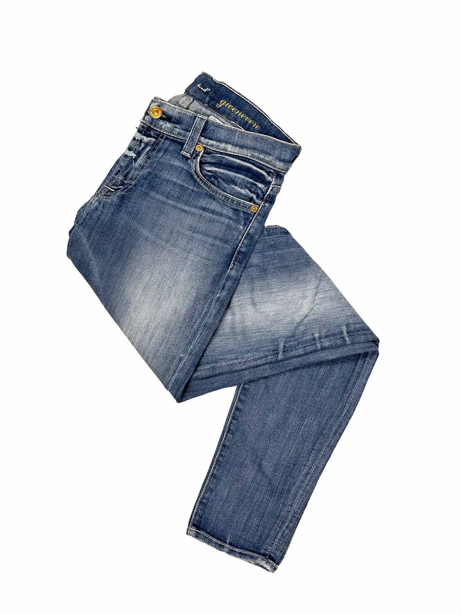 Folded pair of 7 For All Mankind blue jeans on a white background