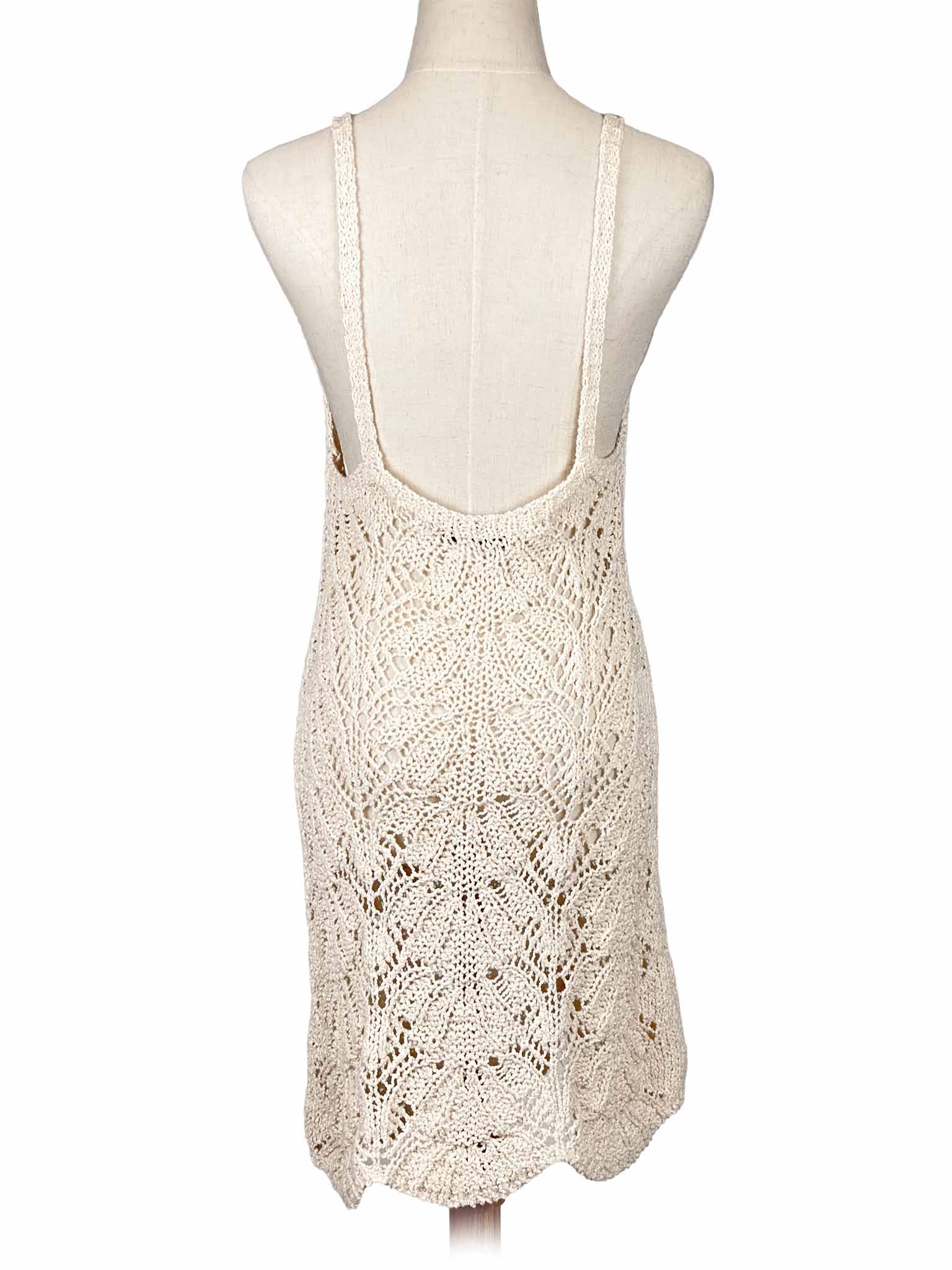 Zara white crochet dress on a mannequin against a white background