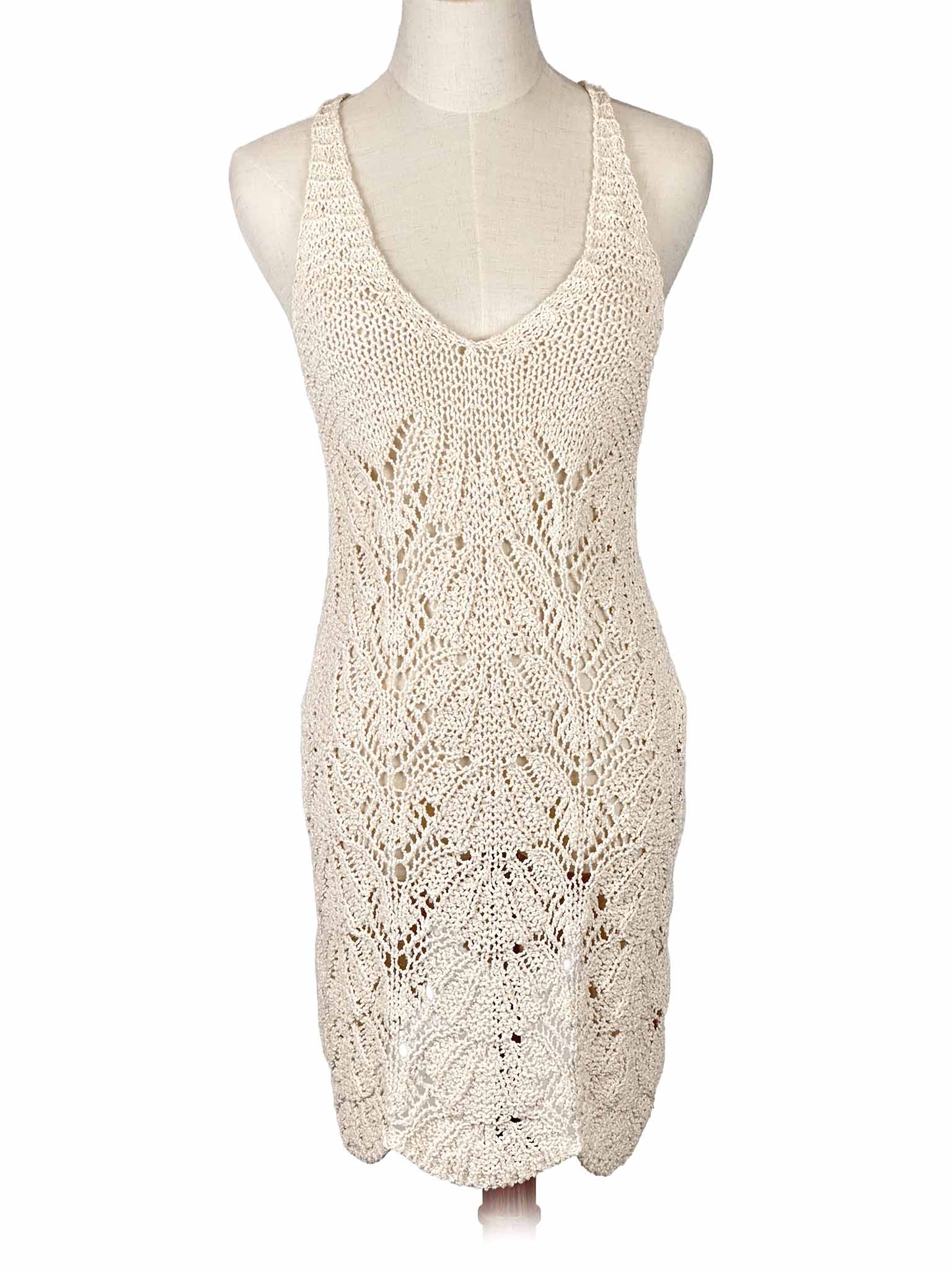 Zara white crochet dress on a mannequin against a white background