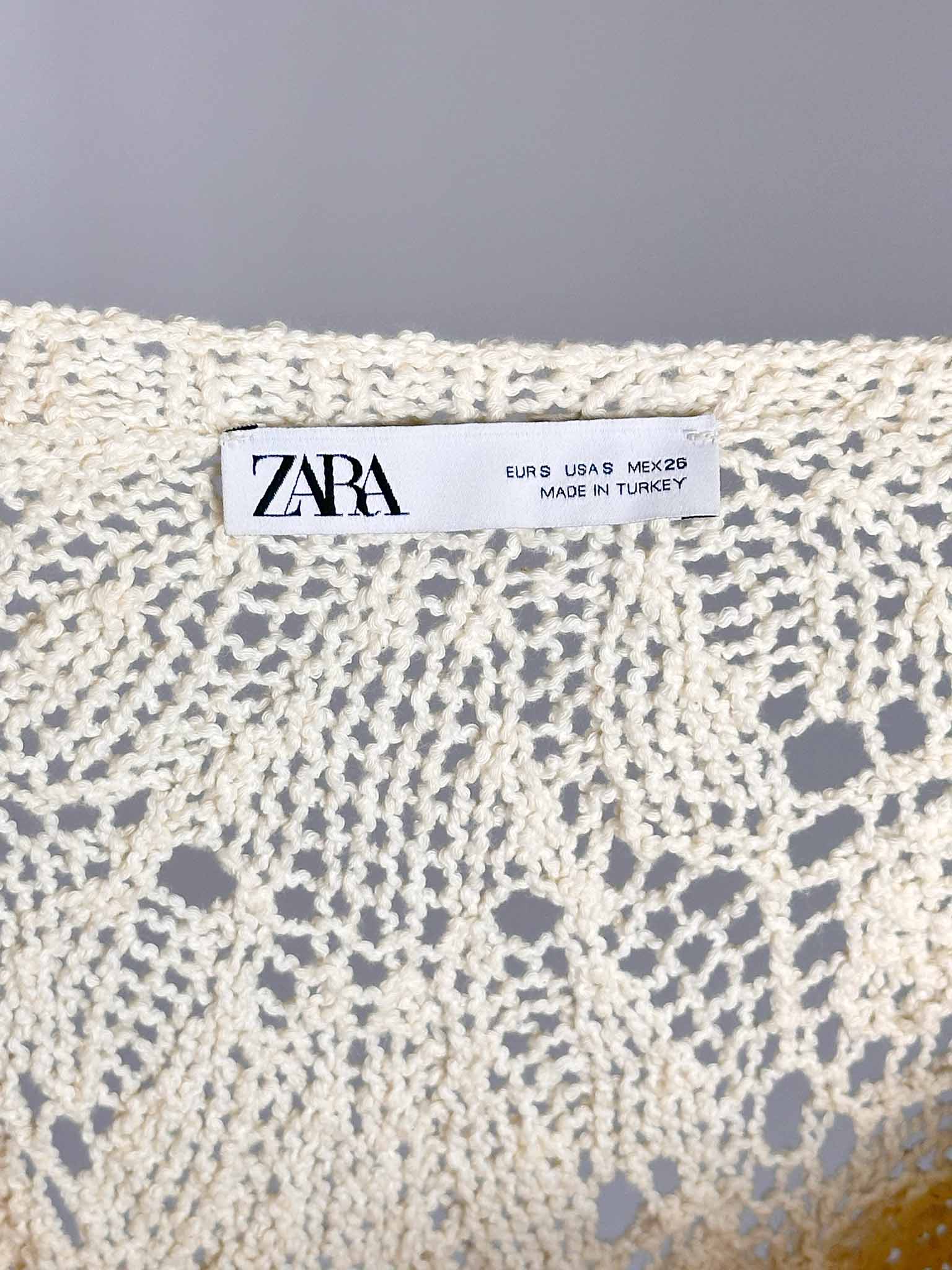 Zara label on a textured fabric background