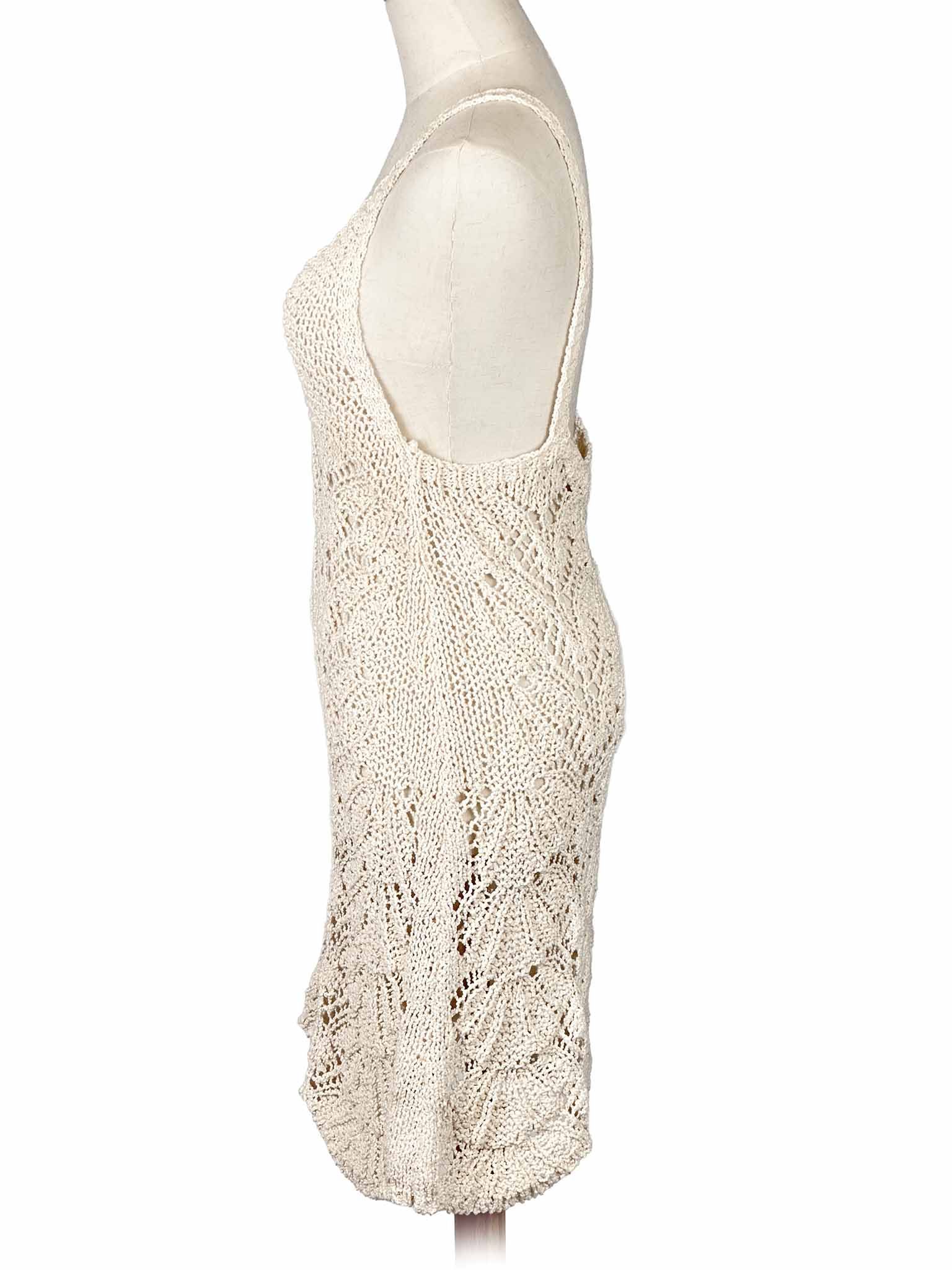 Zara white crochet dress on a mannequin against a white background