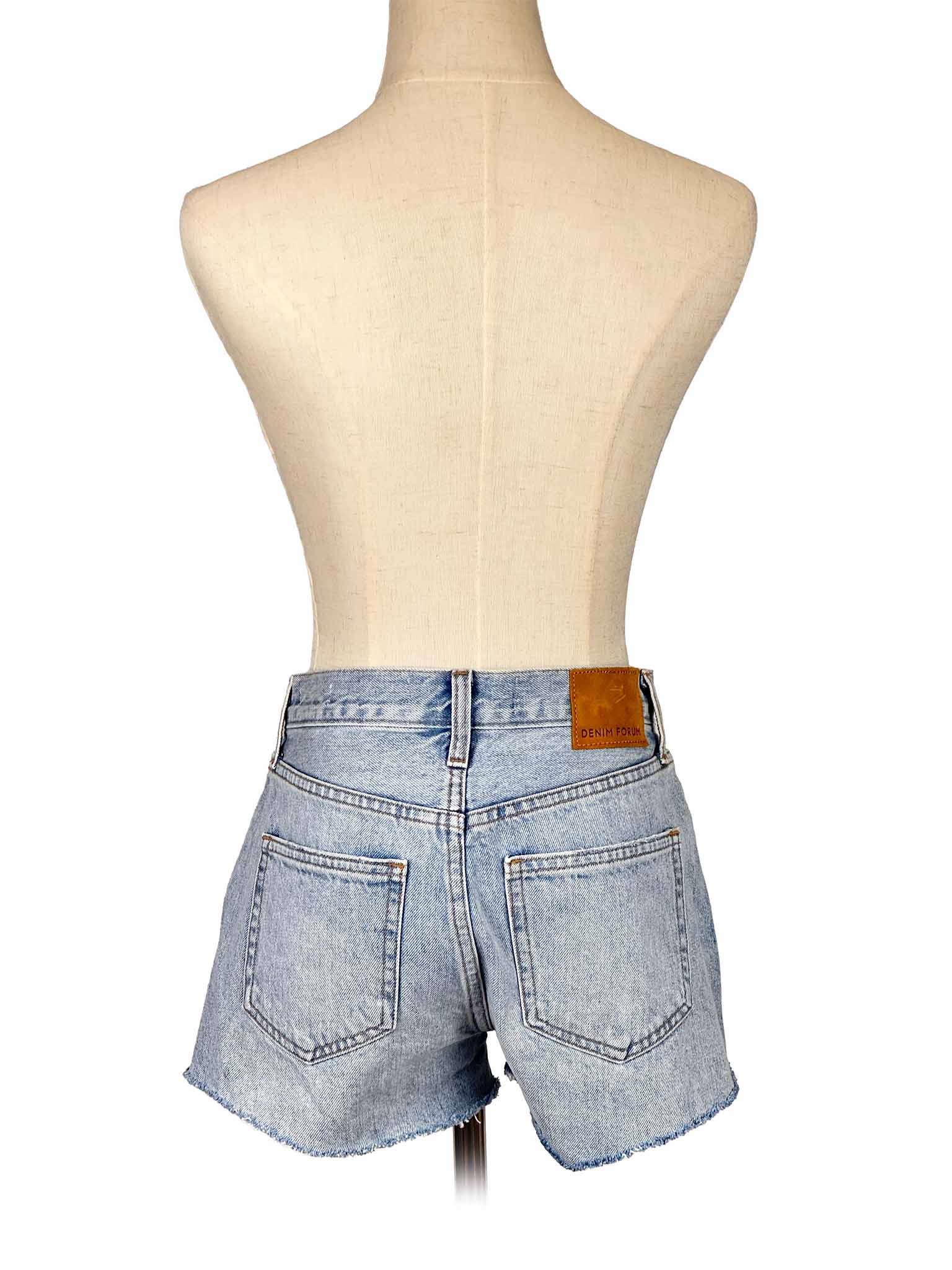 Denim Forum shorts on a mannequin against a white background