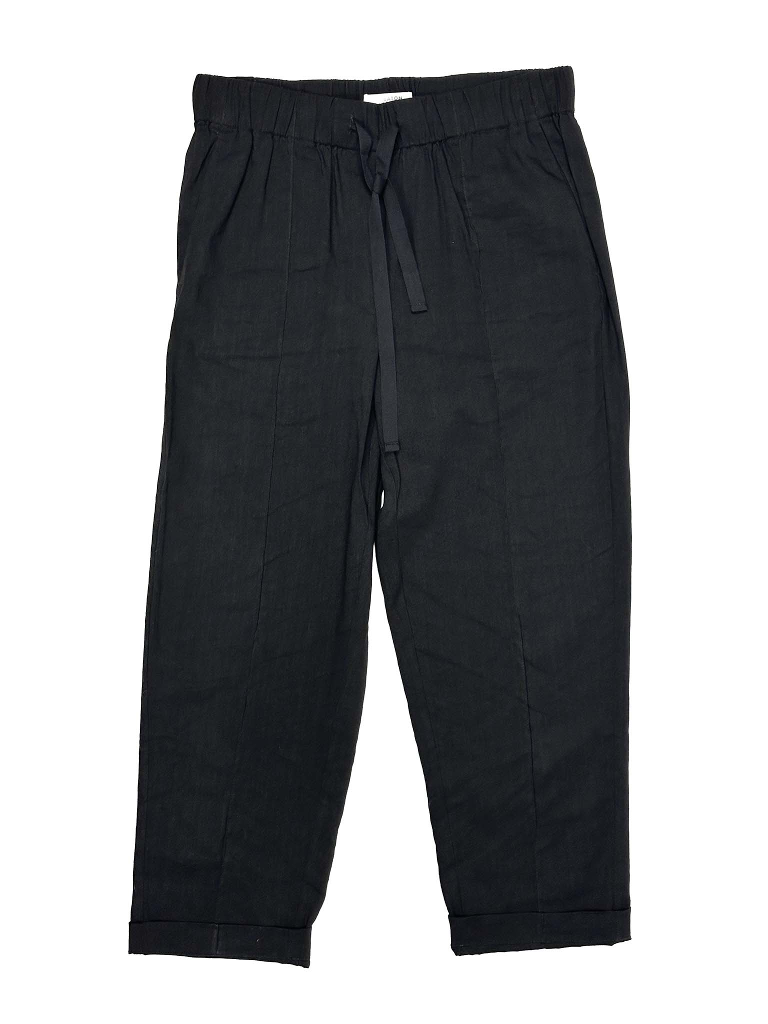 Babaton black linen pants with a tie waist on a white background