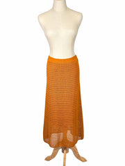Vince orange crochet skirt on a mannequin against a white background
