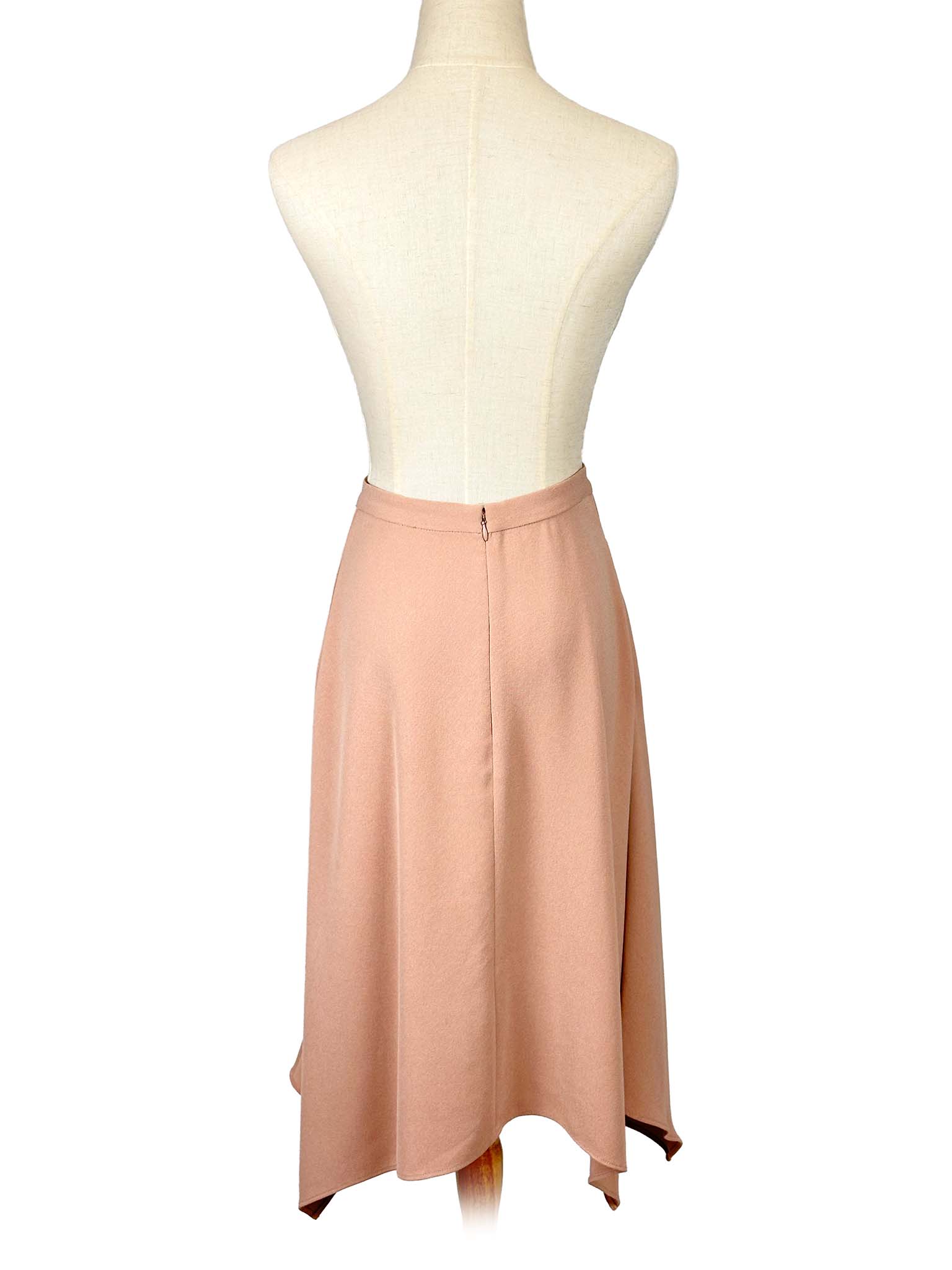 Wilfred pink skirt on a mannequin against a white background