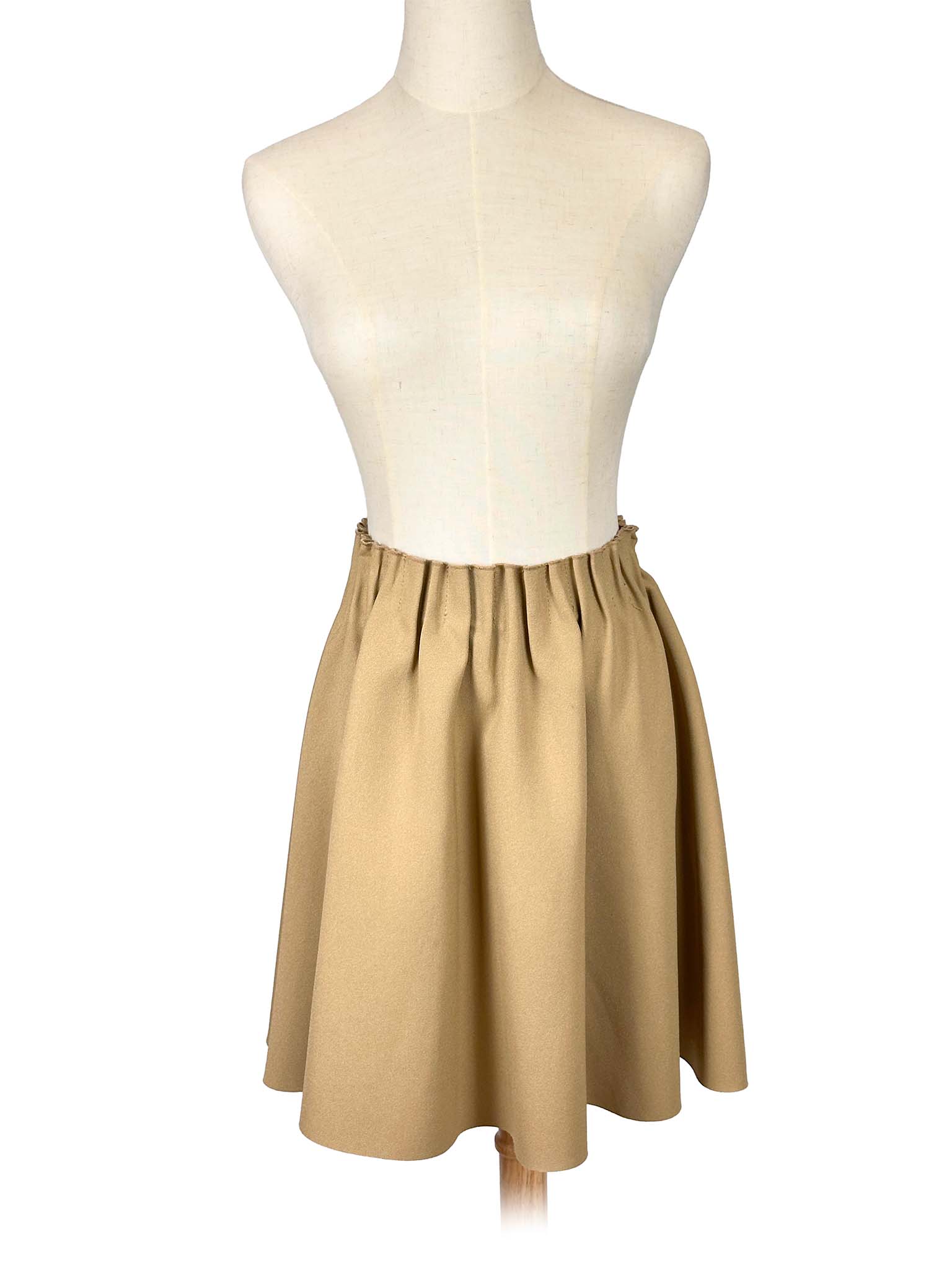 Zara beige circle skirt on a mannequin against a white background