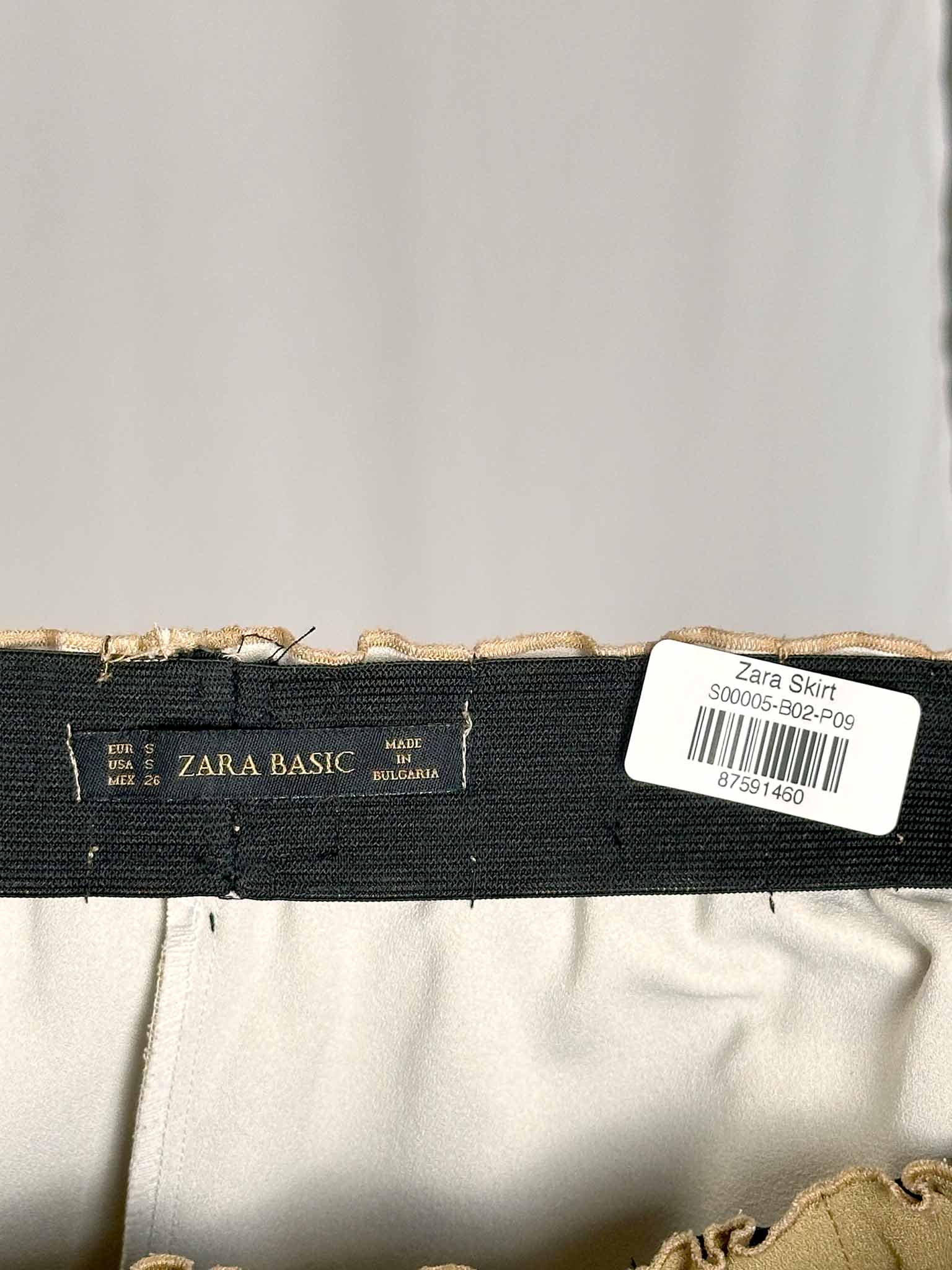 Zara Basic label on a garment against neutral background