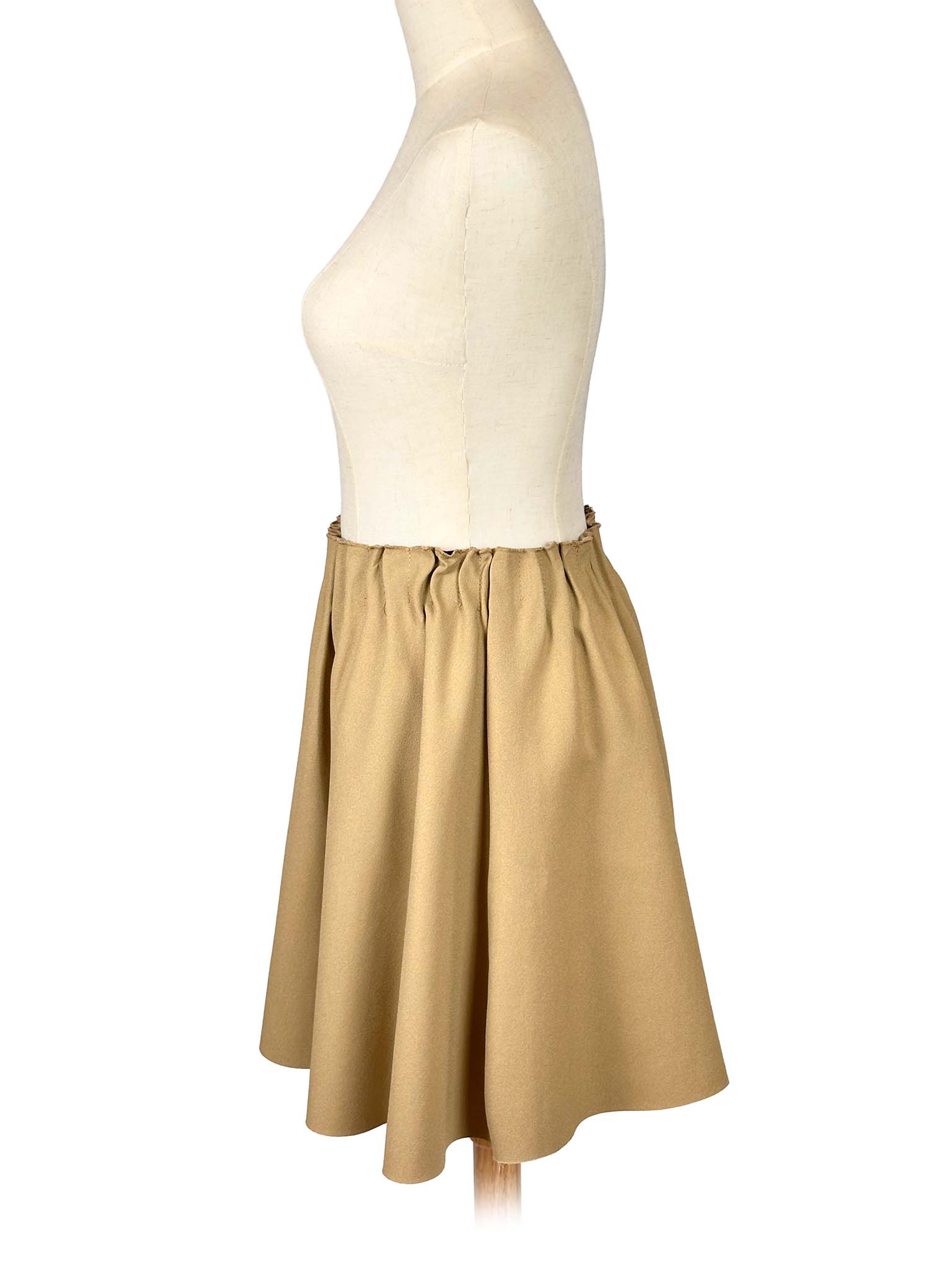Zara beige circle skirt on a mannequin against a white background