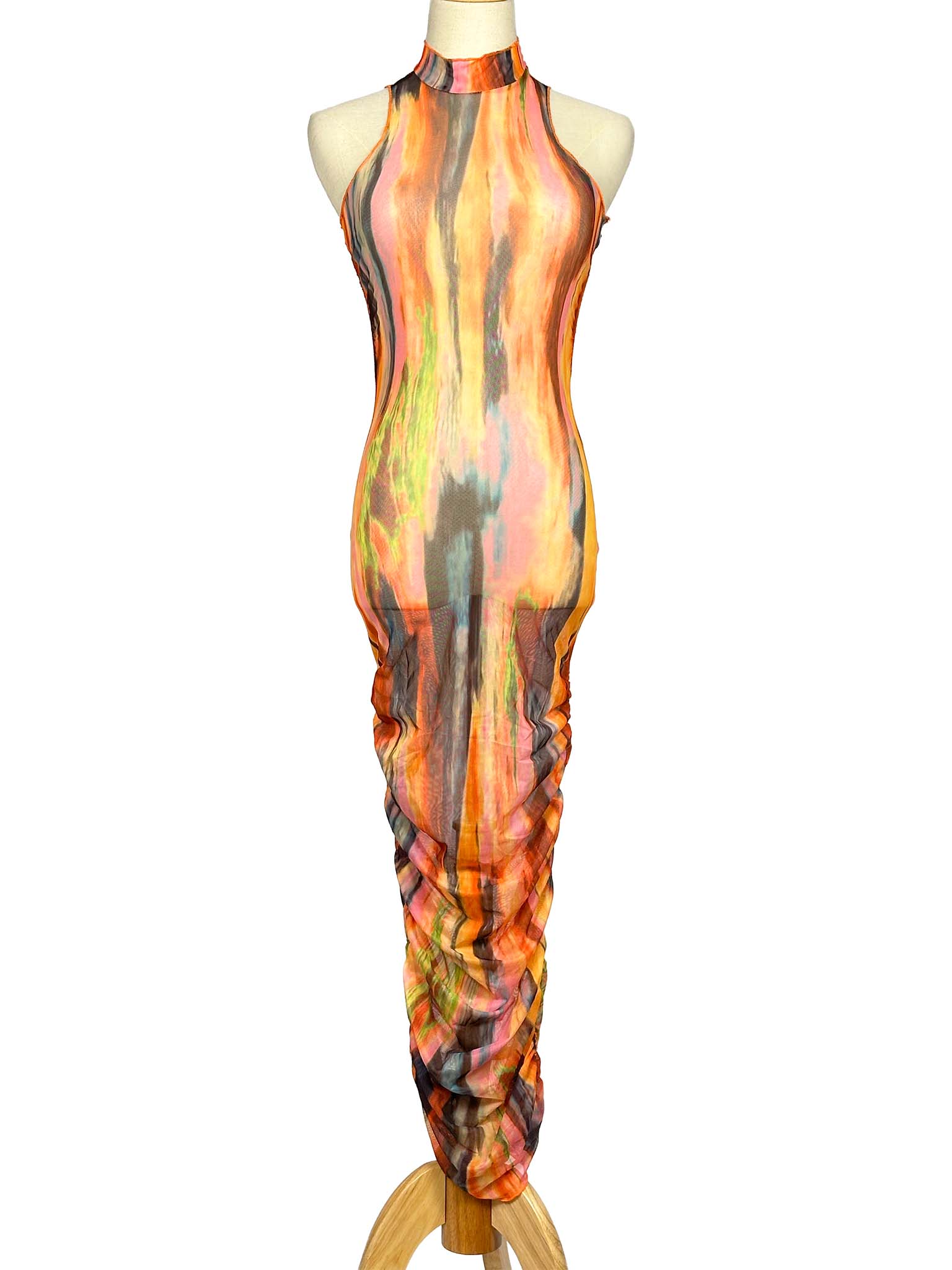 Mannequin wearing a colorful SNDYS. dress with abstract patterns on a white background