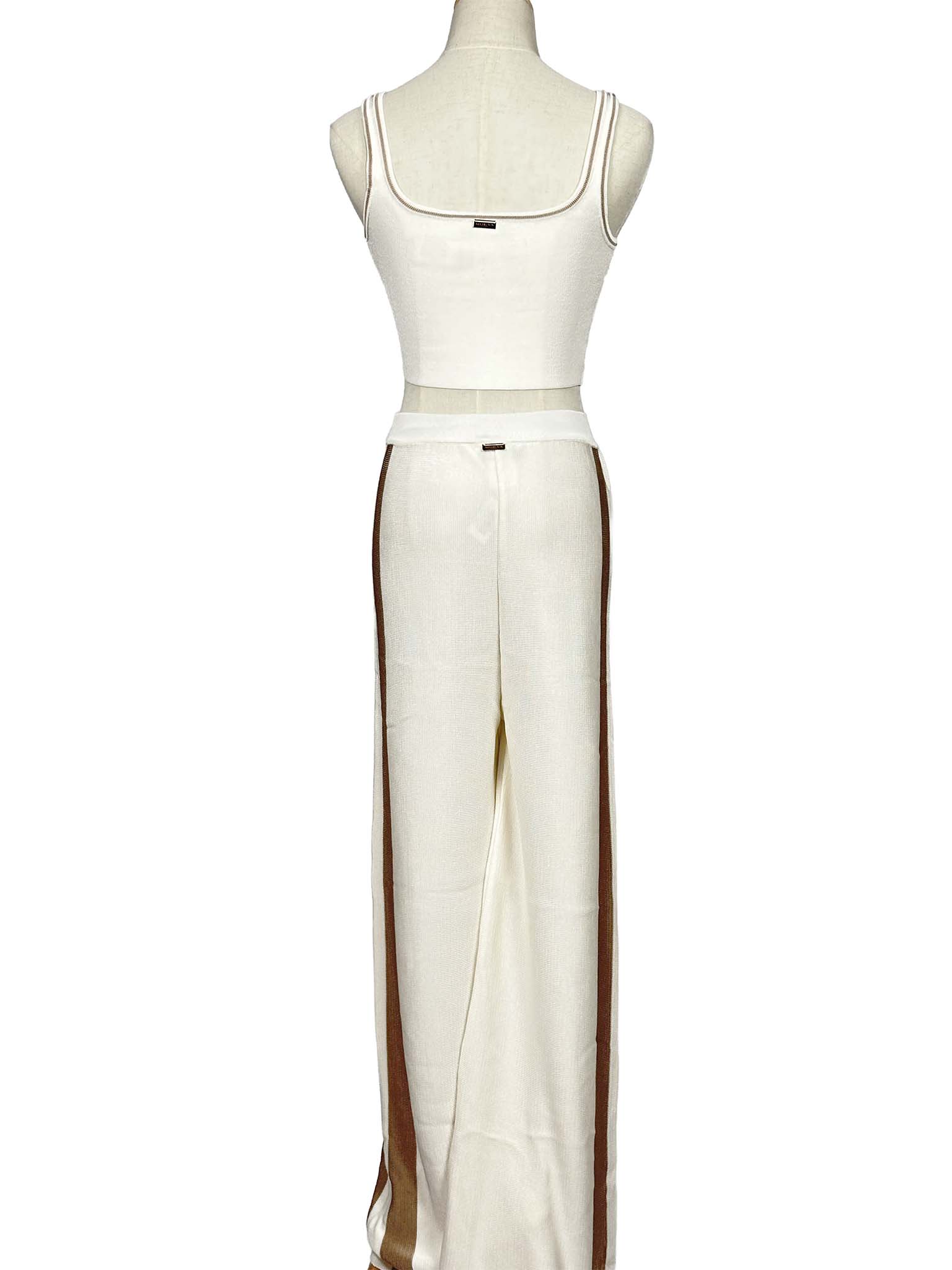 Mannequin wearing a Moeva white sleeveless top and pants set on a white background