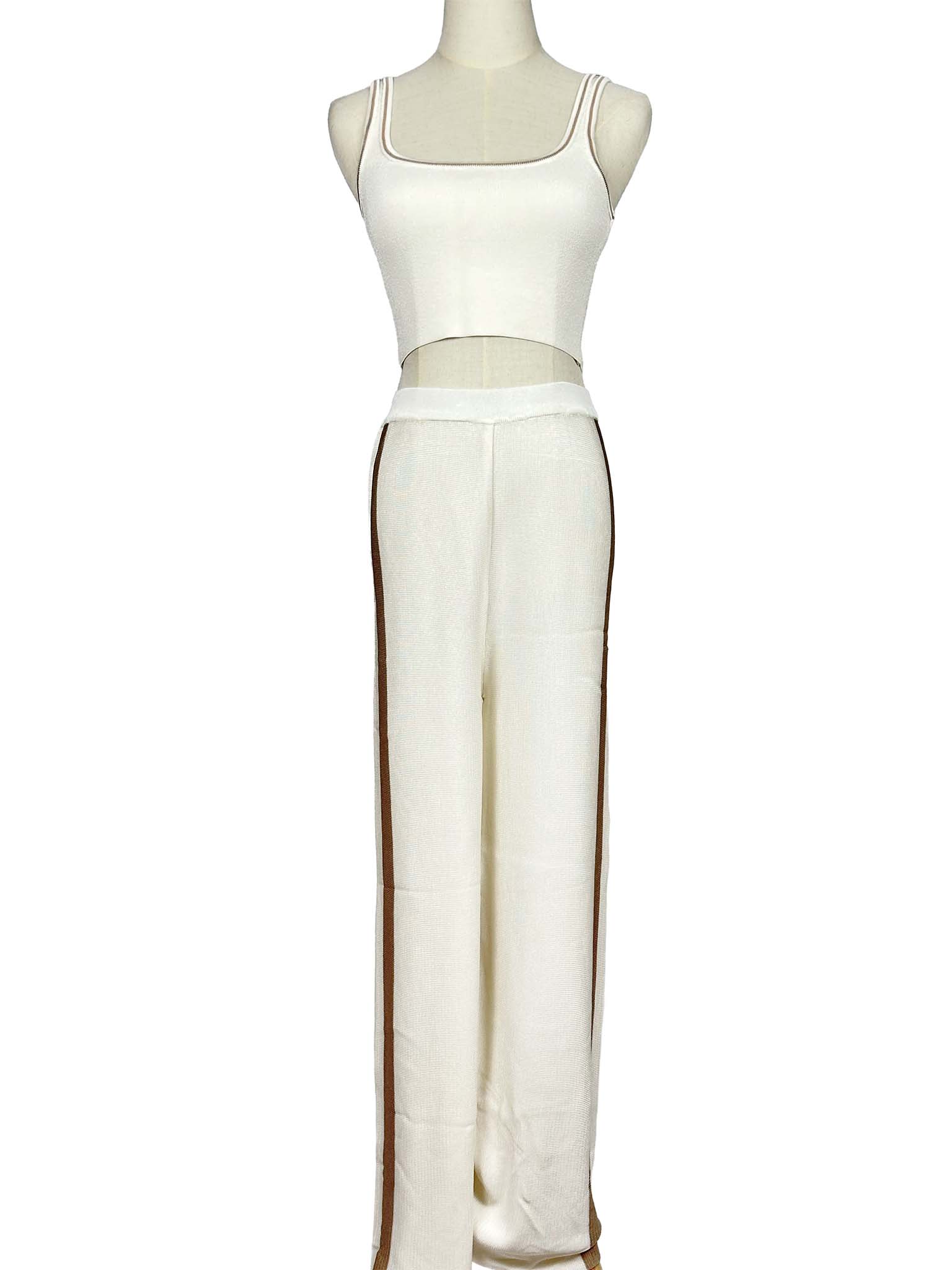 Mannequin wearing a Moeva white sleeveless top and pants set on a white background