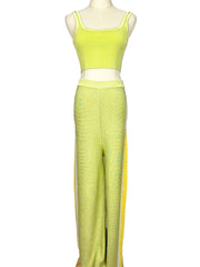 Mannequin wearing a light green Moeva top and pants set on a white background