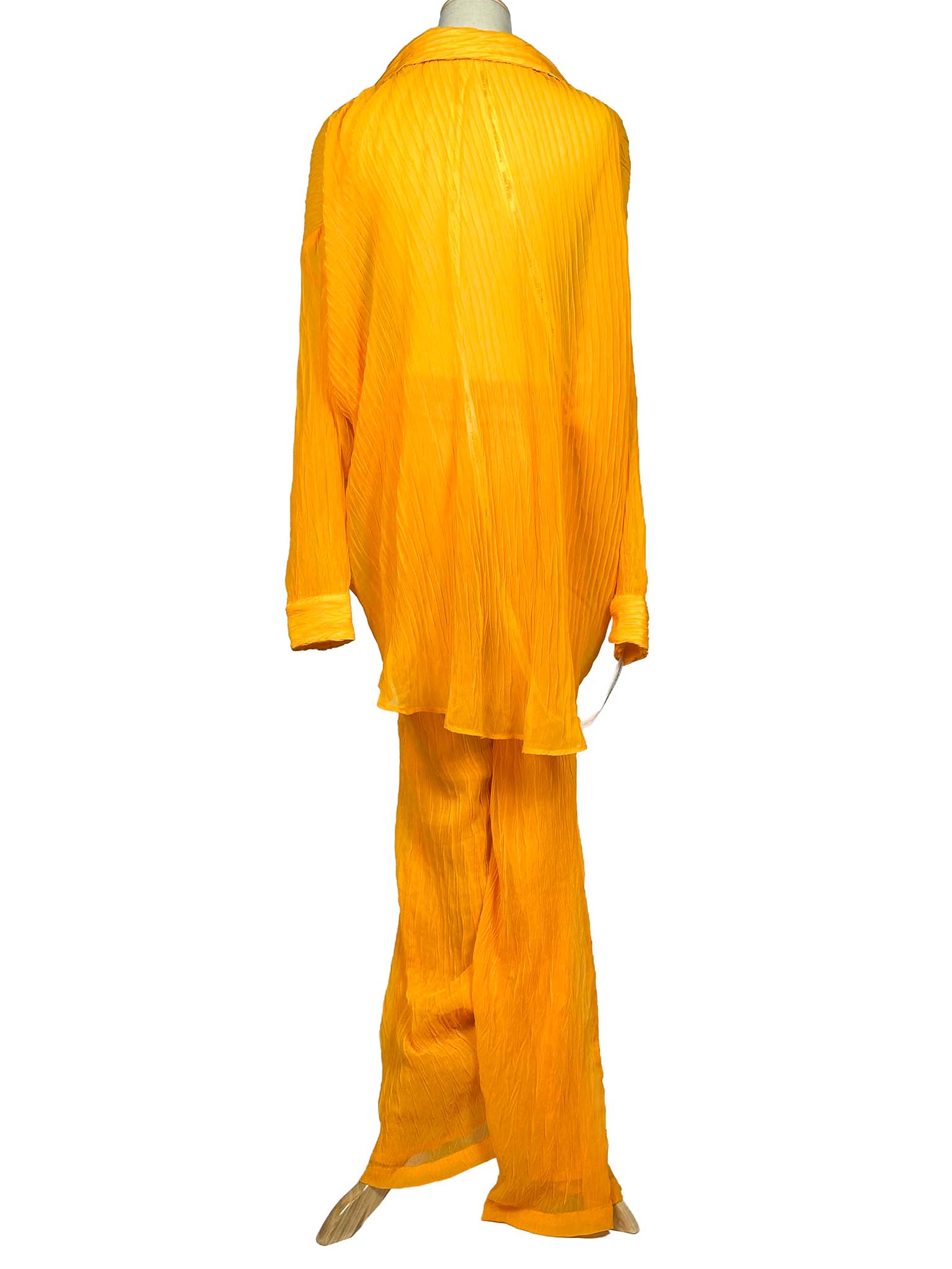 Orange Chic Le Frique top and pants set on a mannequin against a white background