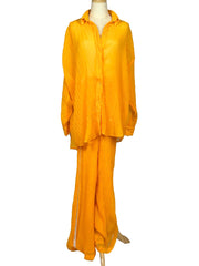 Orange Chic Le Frique top and pants set on a mannequin against a white background