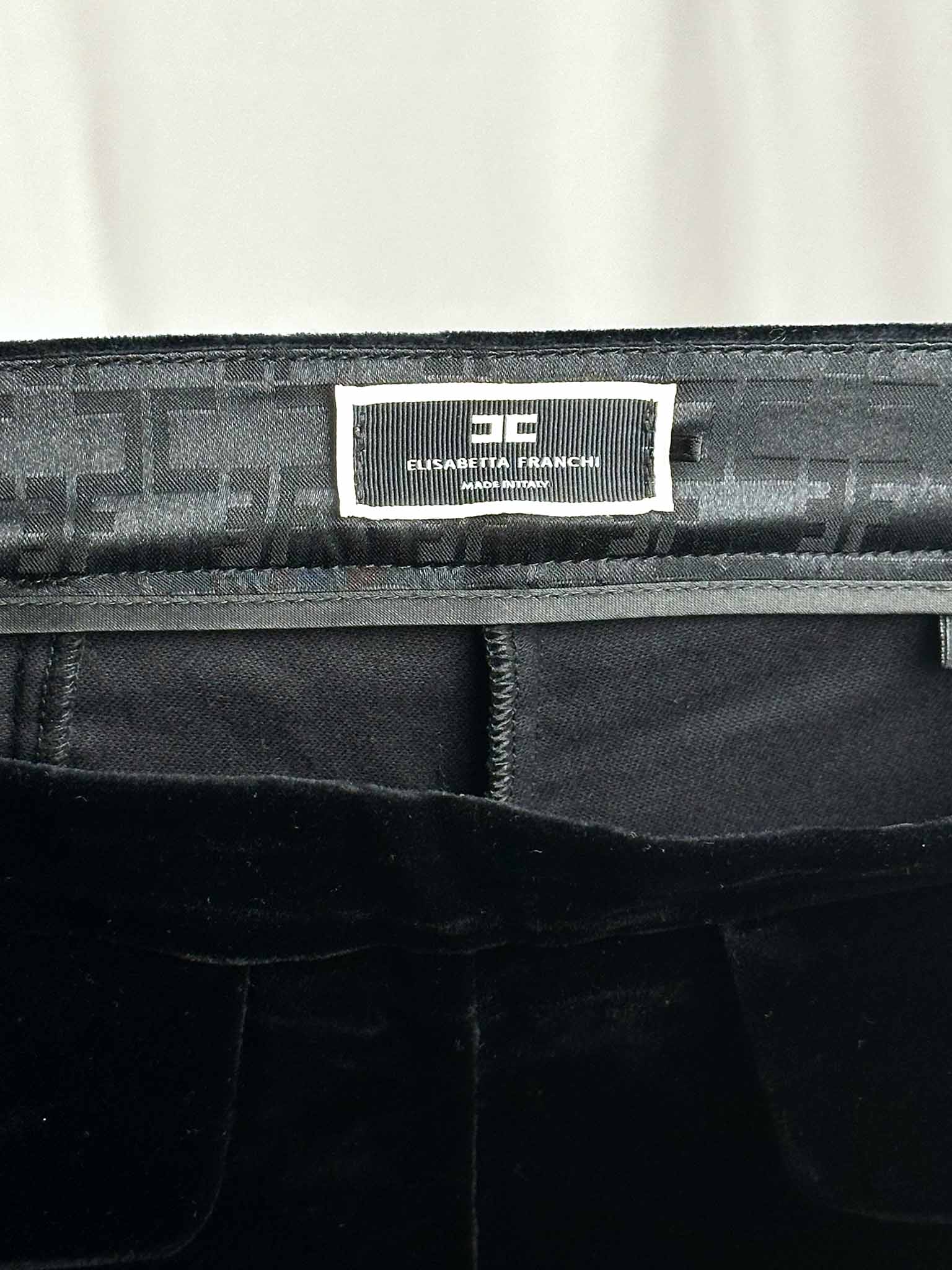 Black bag with a Elisabetta Franchi label on a white background