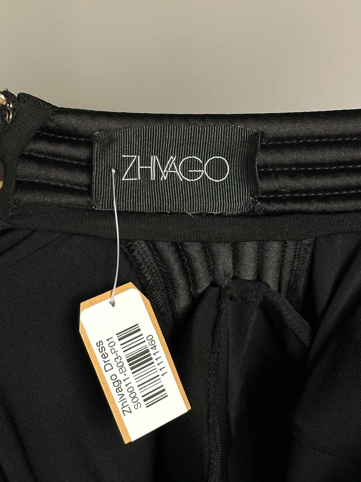 Black garment with a Zhivago label and tag on a neutral background
