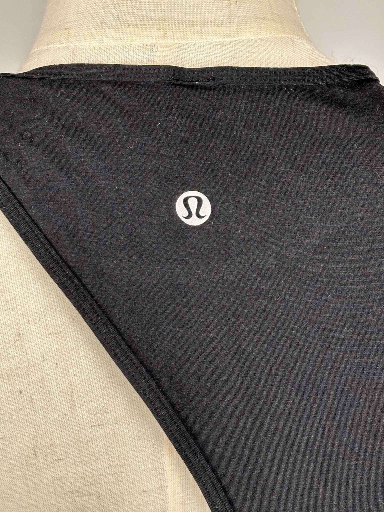 Lululemon black top on a mannequin with a white background