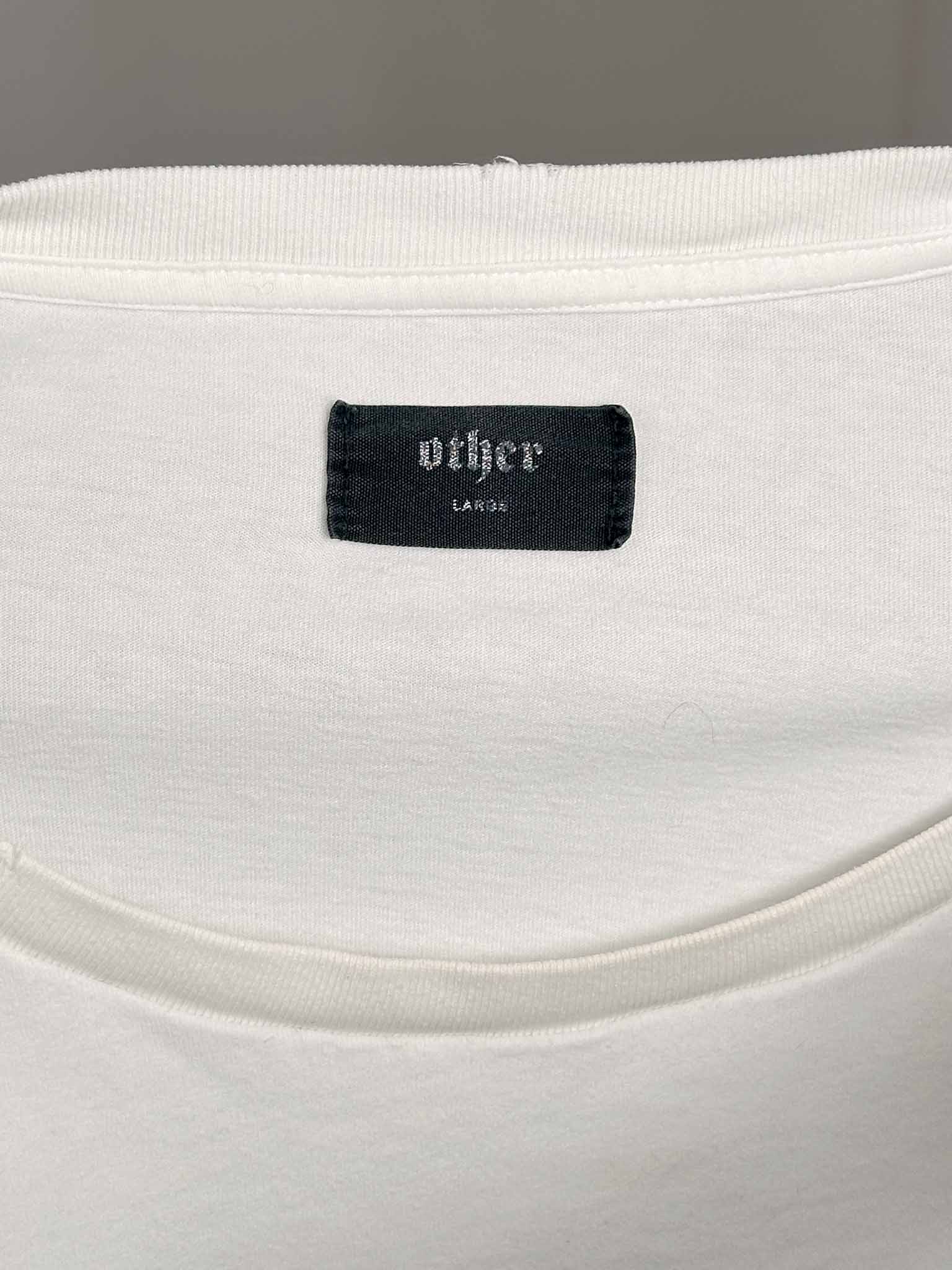 White garment with a black label reading 'other' on a gray background