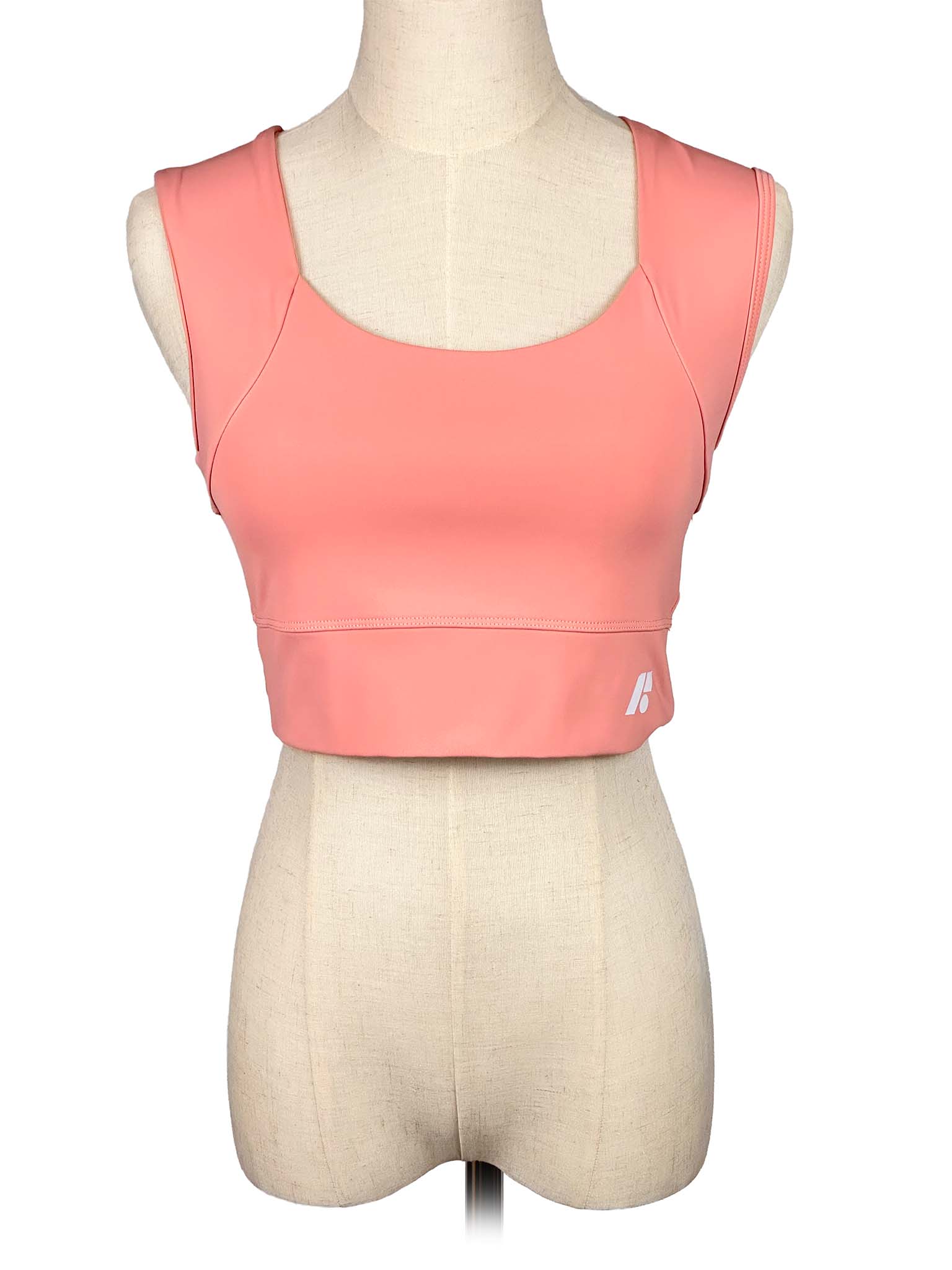 Forme coral sports top on a mannequin with a white background