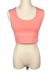 Forme coral sports top on a mannequin with a white background