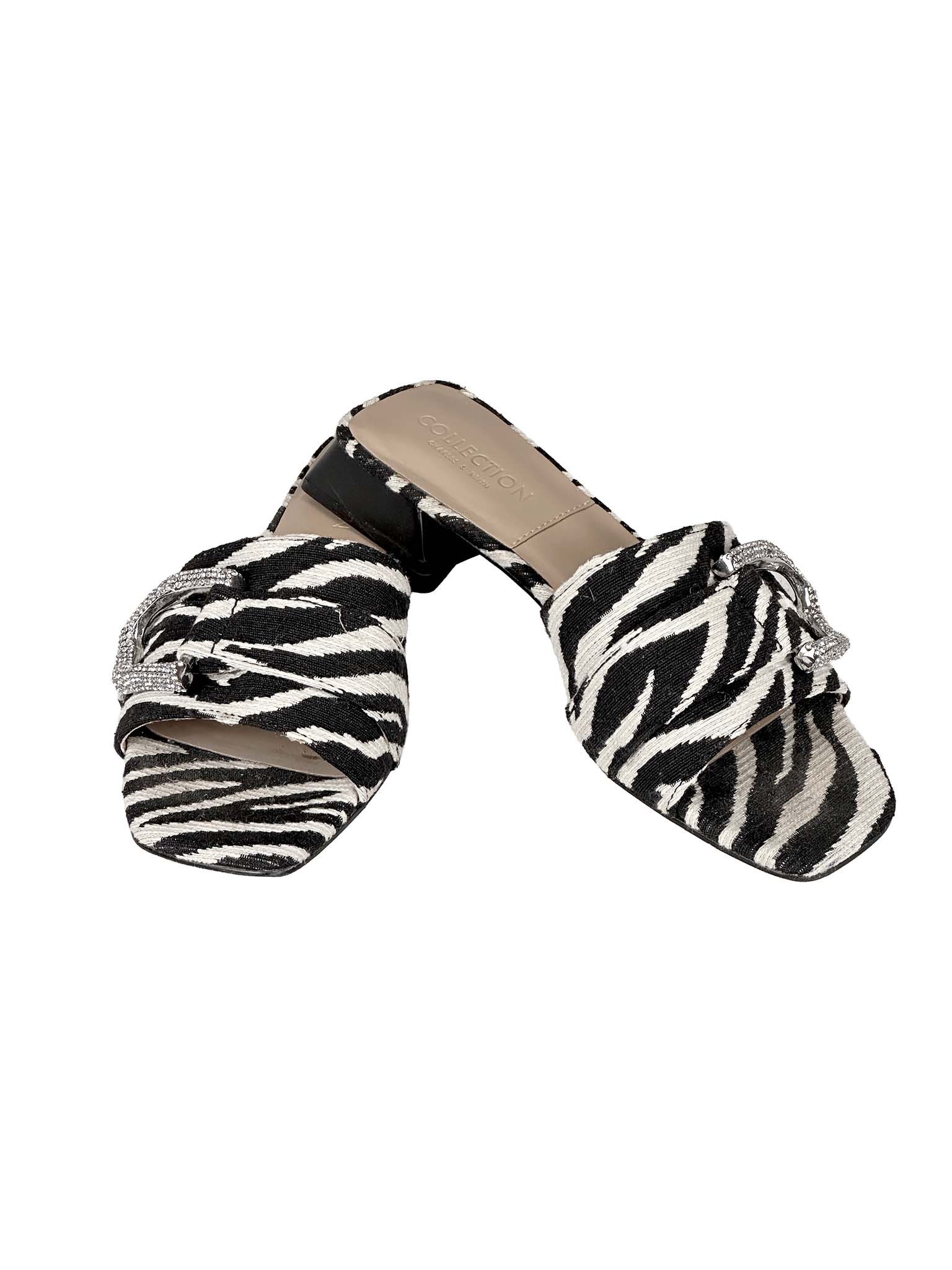 Zebra print Charles & Keith slide sandals with bow detail on a white background