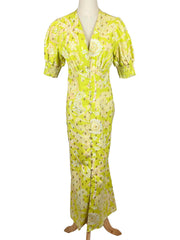 Never Fully Dressed lime floral dress on a mannequin against a white background
