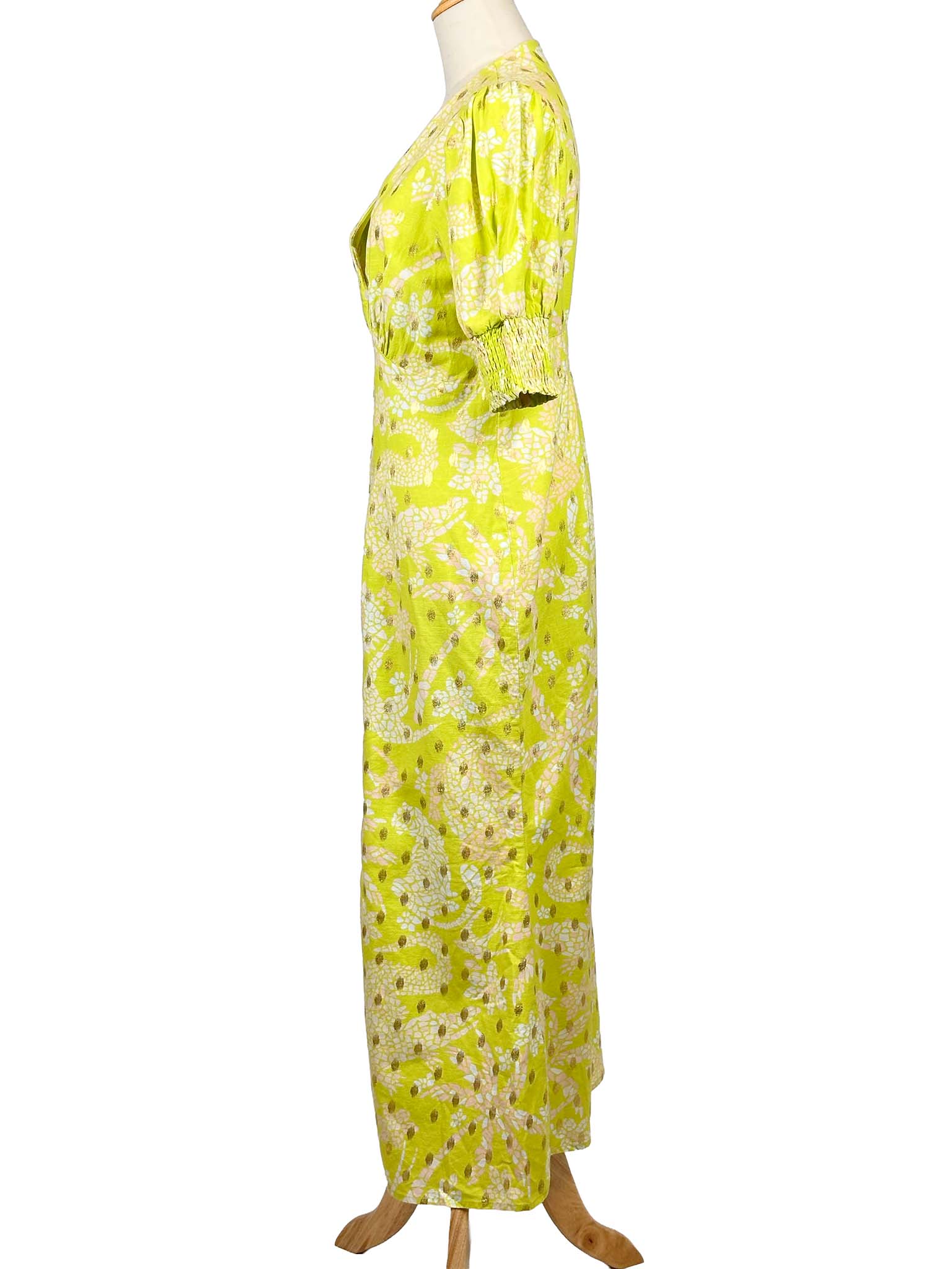 Never Fully Dressed lime floral dress on a mannequin against a white background