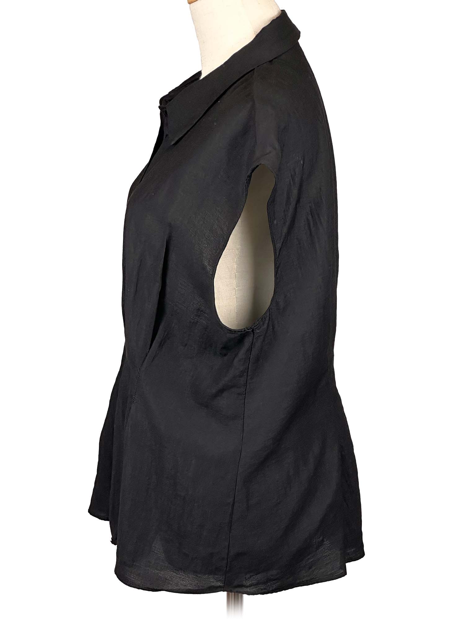 Mango black sleeveless shirt on a mannequin against a white background